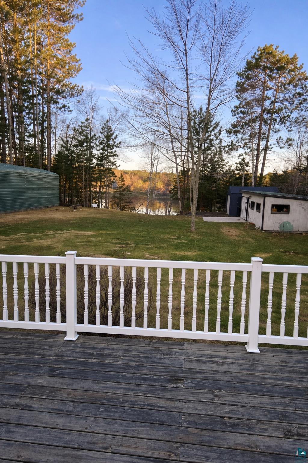 3975 Long Lake Shores Road Eveleth, MN 55734 - Photo 63 of 79 Wooden terrace with a yard, a water view, and an outbuilding