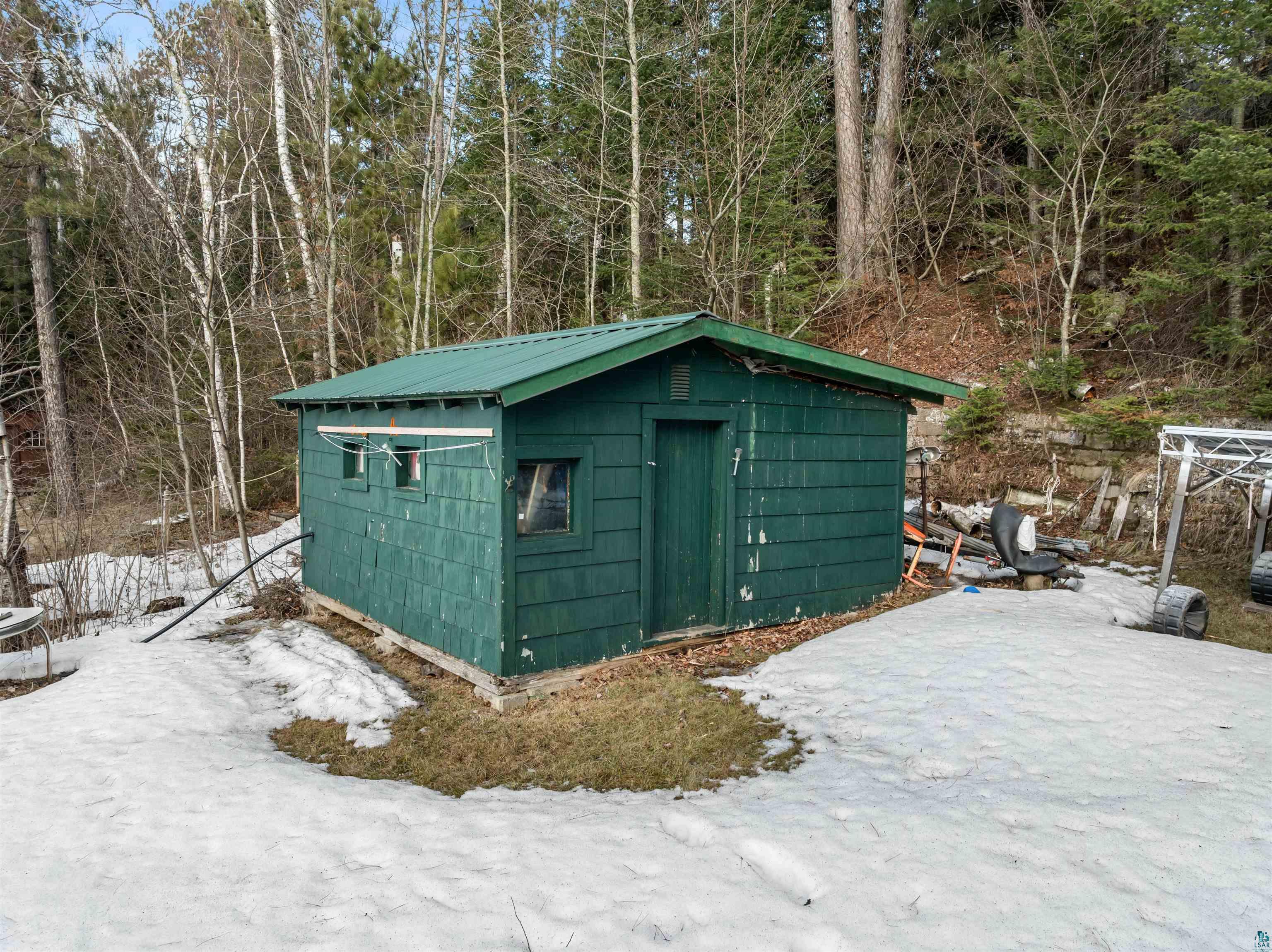 3975 Long Lake Shores Road Eveleth, MN 55734 - Photo 76 of 79 Snow covered structure featuring a storage unit