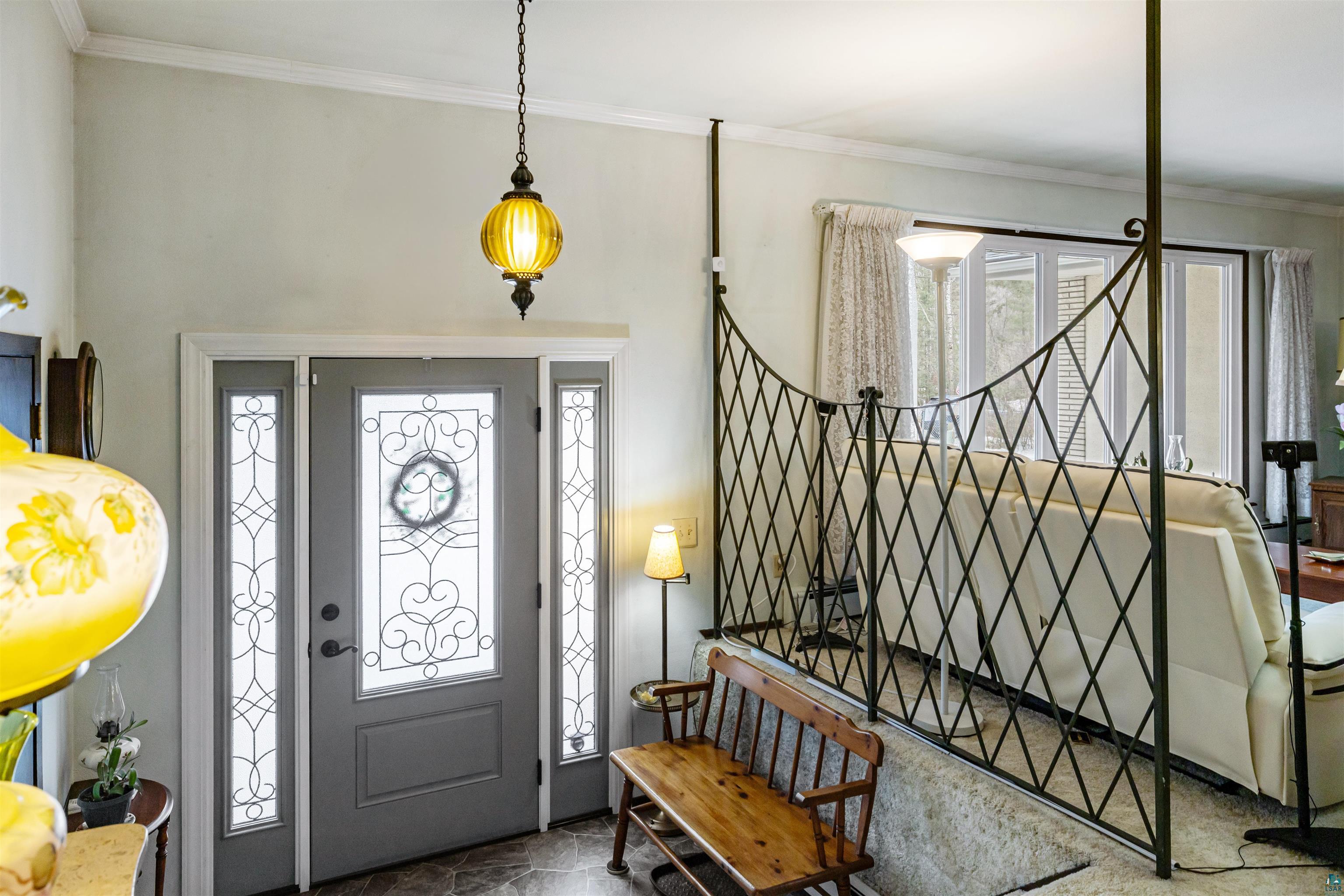 3975 Long Lake Shores Road Eveleth, MN 55734 - Photo 8 of 79 Foyer featuring ornamental molding and stone finish floors