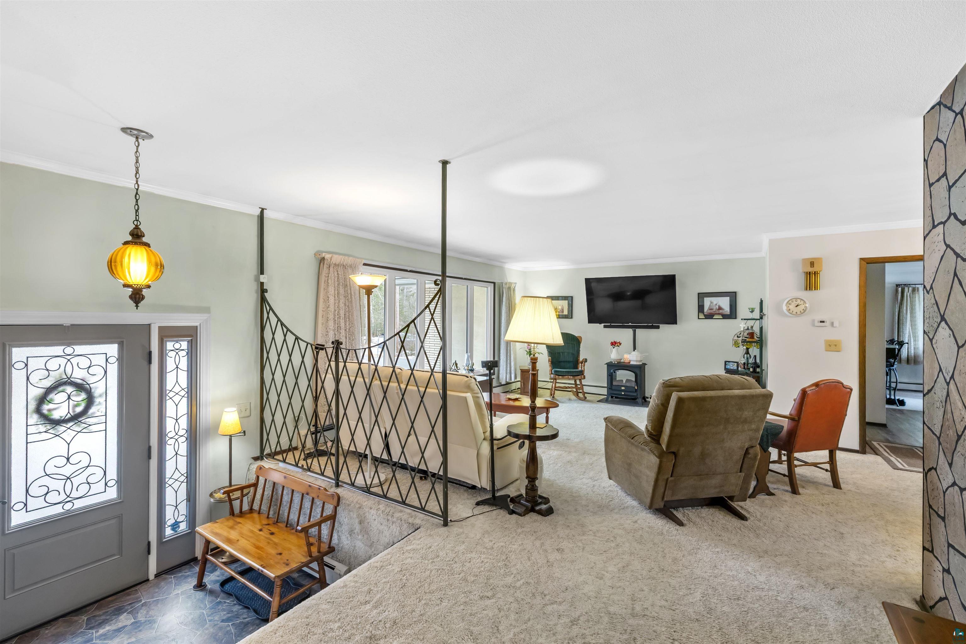 3975 Long Lake Shores Road Eveleth, MN 55734 - Photo 9 of 79 Living area featuring ornamental molding and carpet floors