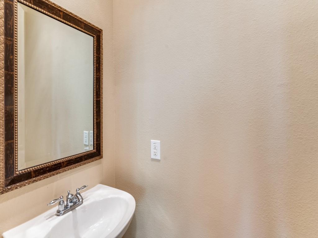 15711 Spectrum Drive, Unit 80 Addison, TX 75001 - Photo 15 of 26 a bathroom with a sink and a mirror