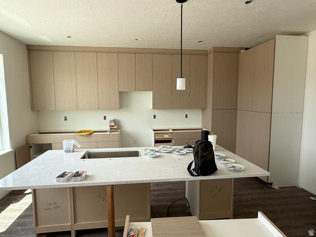 1008 West 3410 South Nibley, UT 84321 - Photo 5 of 26 Expansive kitchen island featuring a built-in sink and white stone-finish countertop