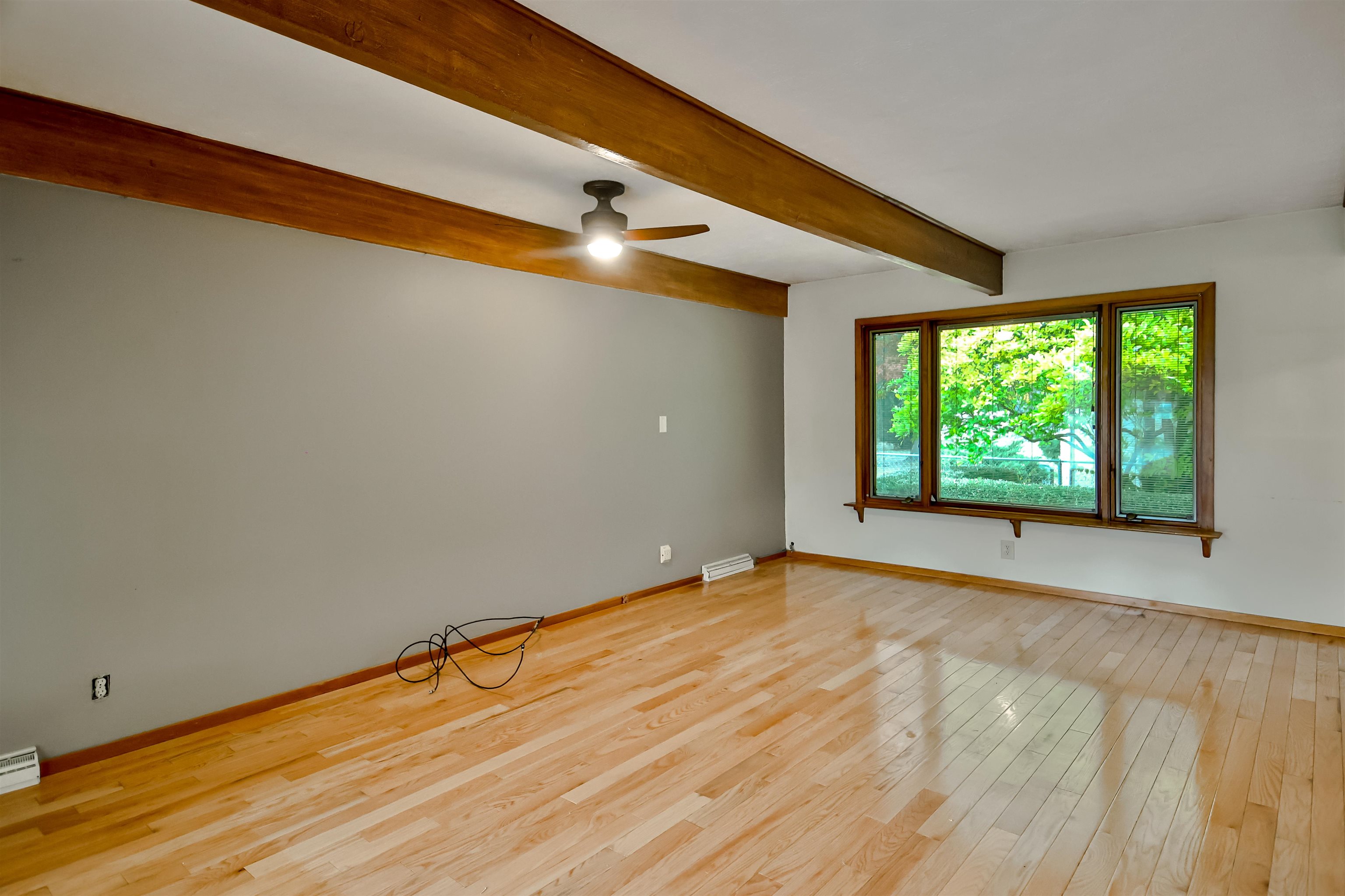 4520 Guilford Road Rockford, IL 61107 - Photo 17 of 28 a view of an empty room with wooden floor and a window