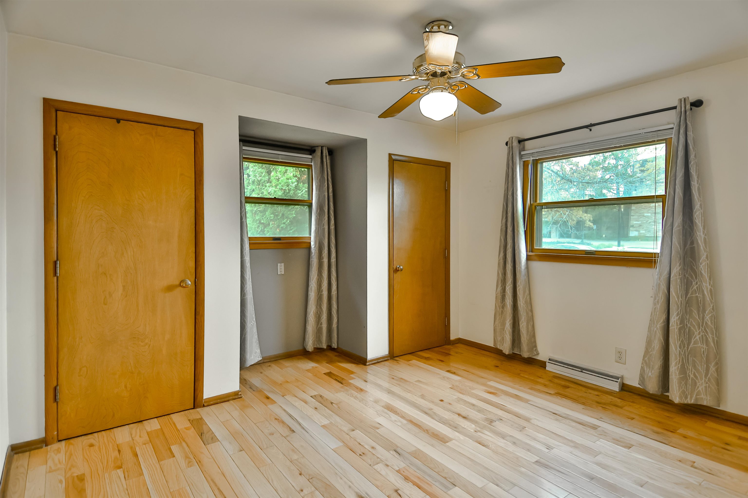 4520 Guilford Road Rockford, IL 61107 - Photo 18 of 28 a view of empty room with wooden floor and fan