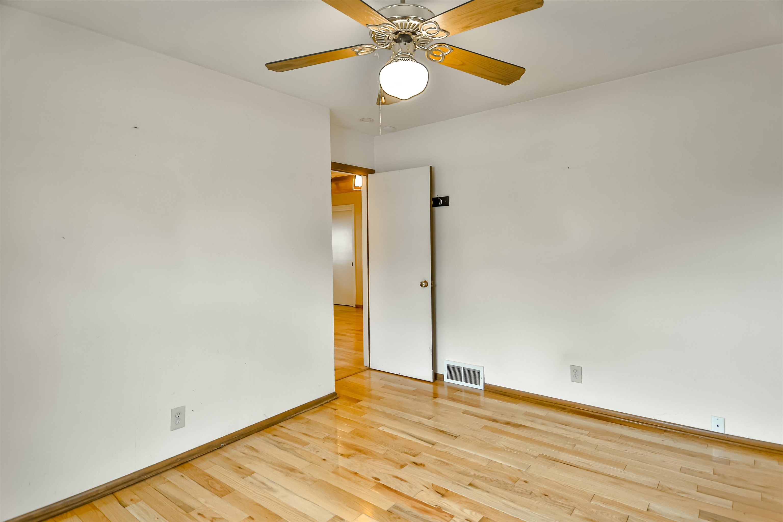 4520 Guilford Road Rockford, IL 61107 - Photo 20 of 28 a view of an empty room with wooden floor