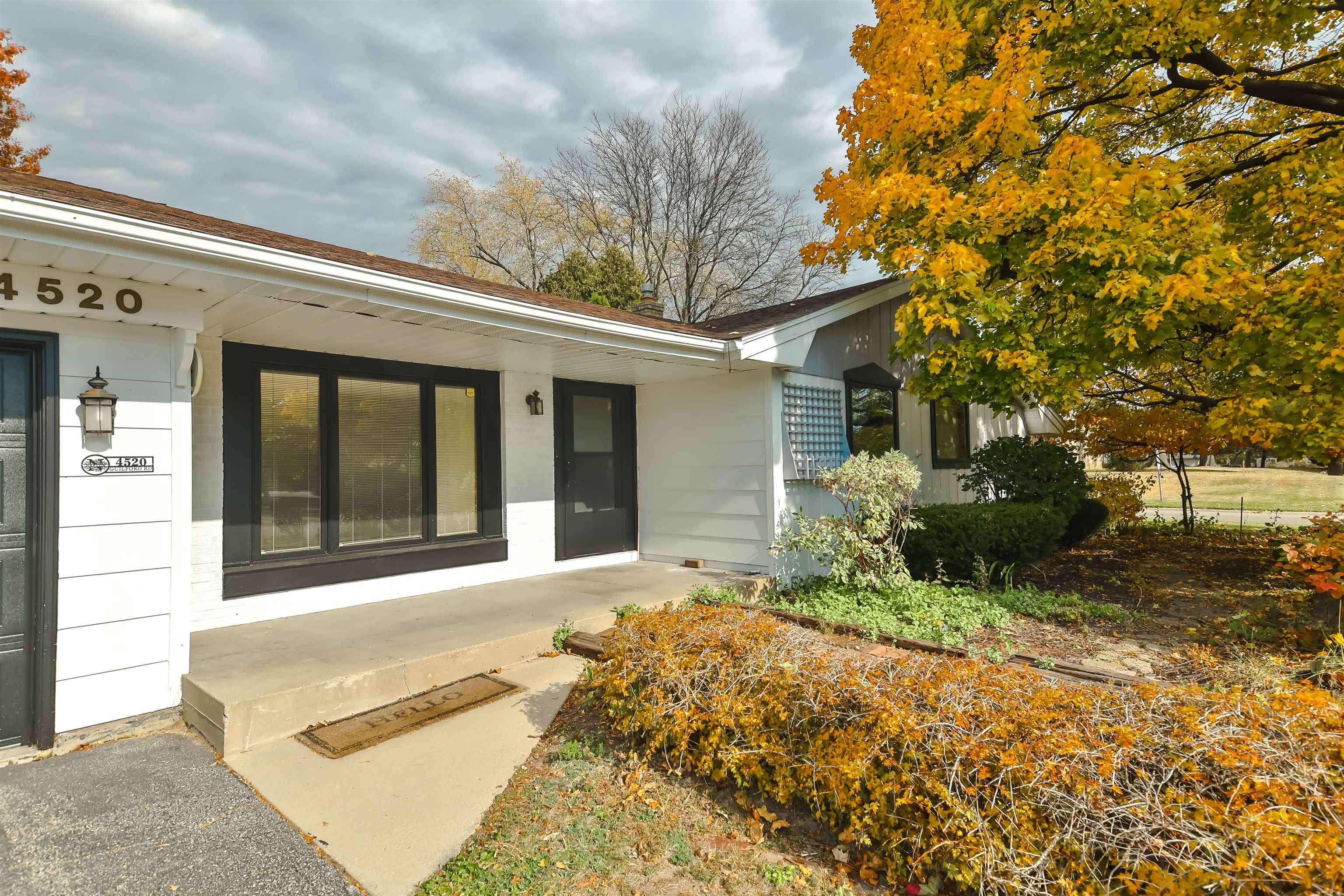 4520 Guilford Road Rockford, IL 61107 - Photo 2 of 28 a front view of a house with a yard