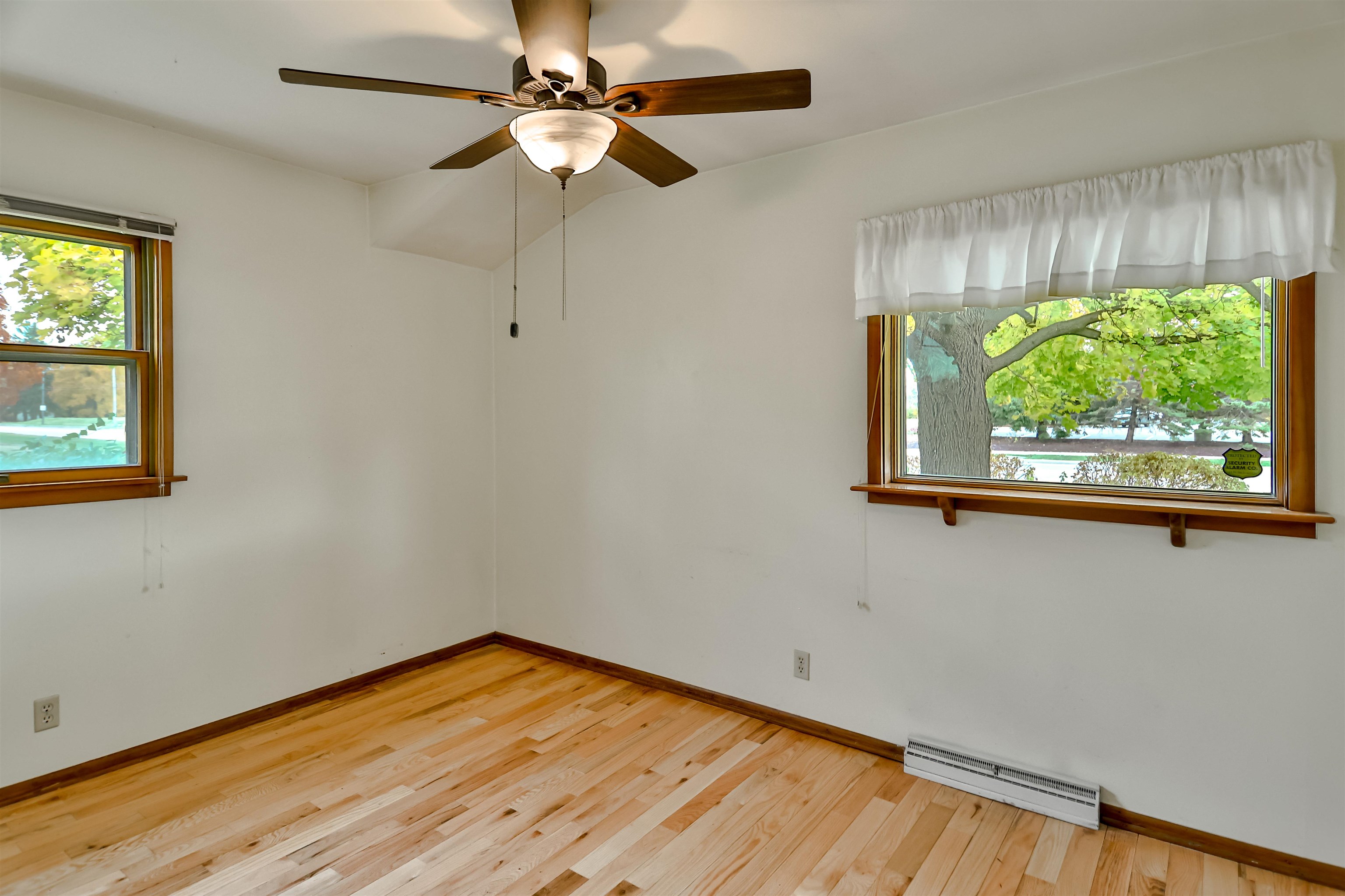 4520 Guilford Road Rockford, IL 61107 - Photo 22 of 28 a view of empty room with wooden floor and fan