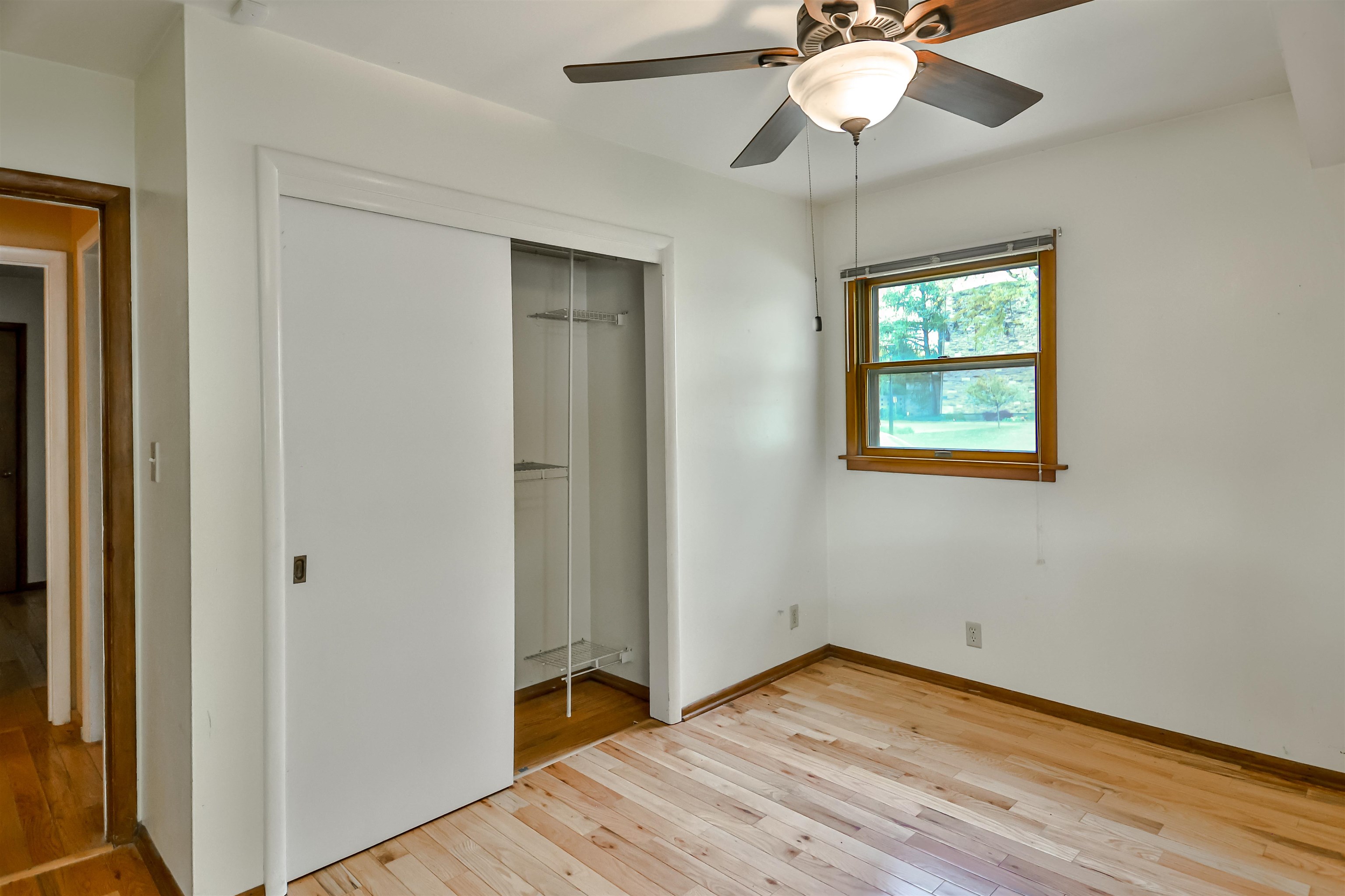 4520 Guilford Road Rockford, IL 61107 - Photo 23 of 28 a view of empty room with wooden floor and fan