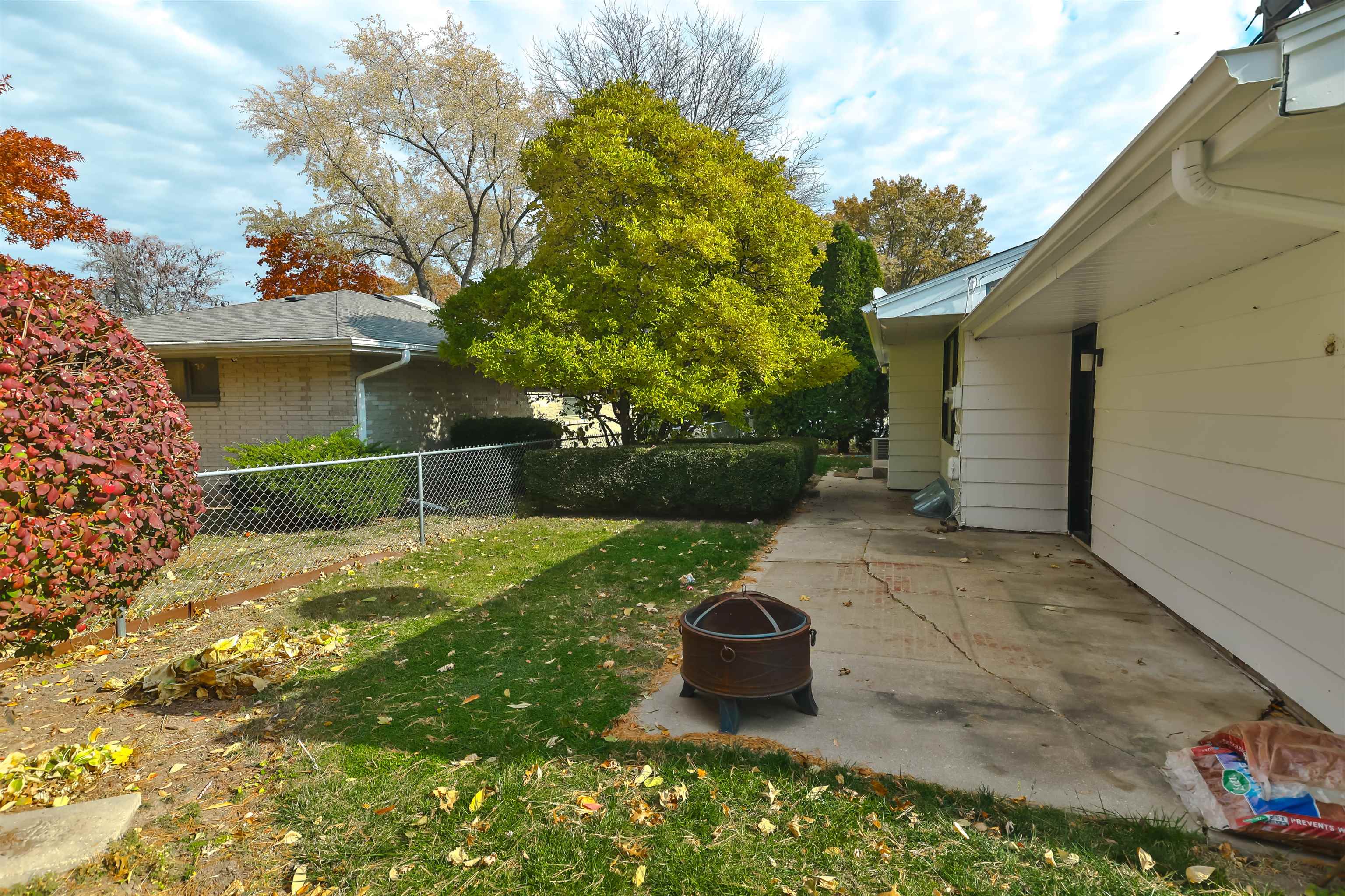 4520 Guilford Road Rockford, IL 61107 - Photo 28 of 28 a view of a backyard with table and chairs and potted plants