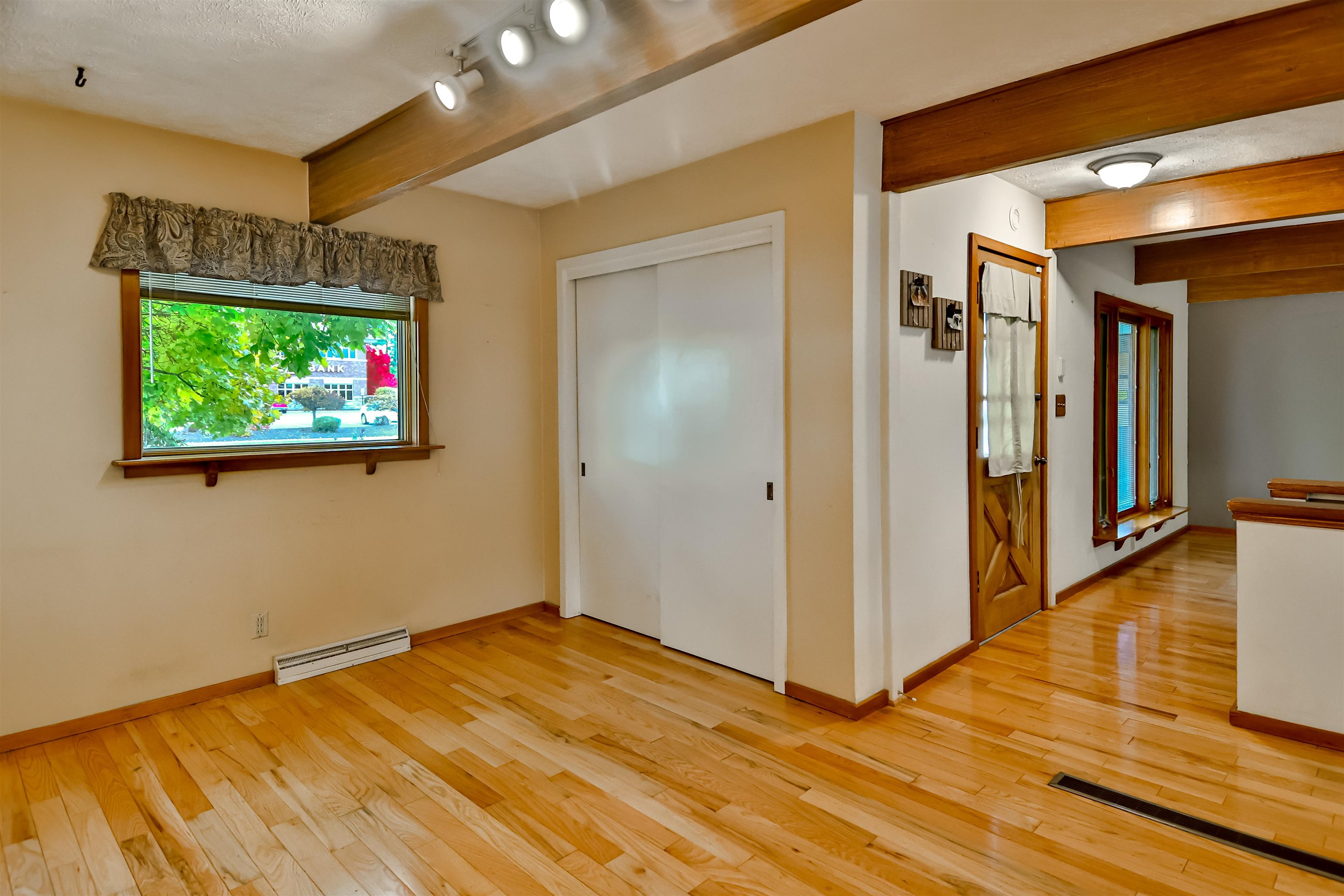 4520 Guilford Road Rockford, IL 61107 - Photo 8 of 28 a view of a room with wooden floor and windows