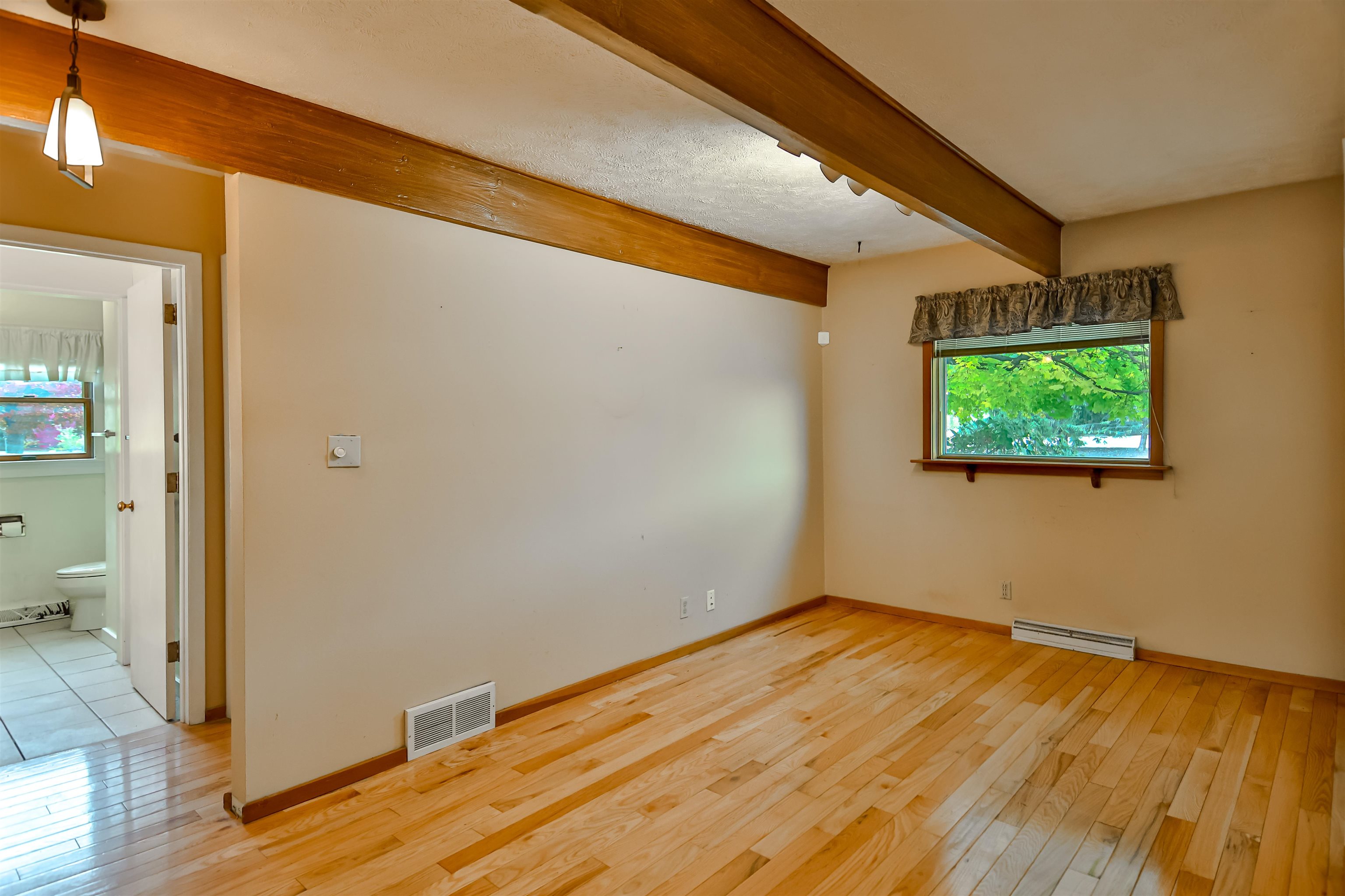 4520 Guilford Road Rockford, IL 61107 - Photo 9 of 28 a view of empty room with wooden floor and fan