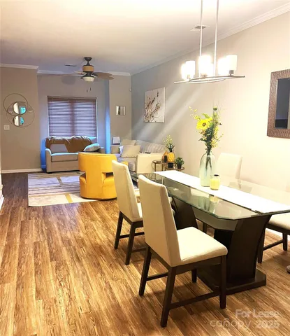 a dining room with a table and chairs