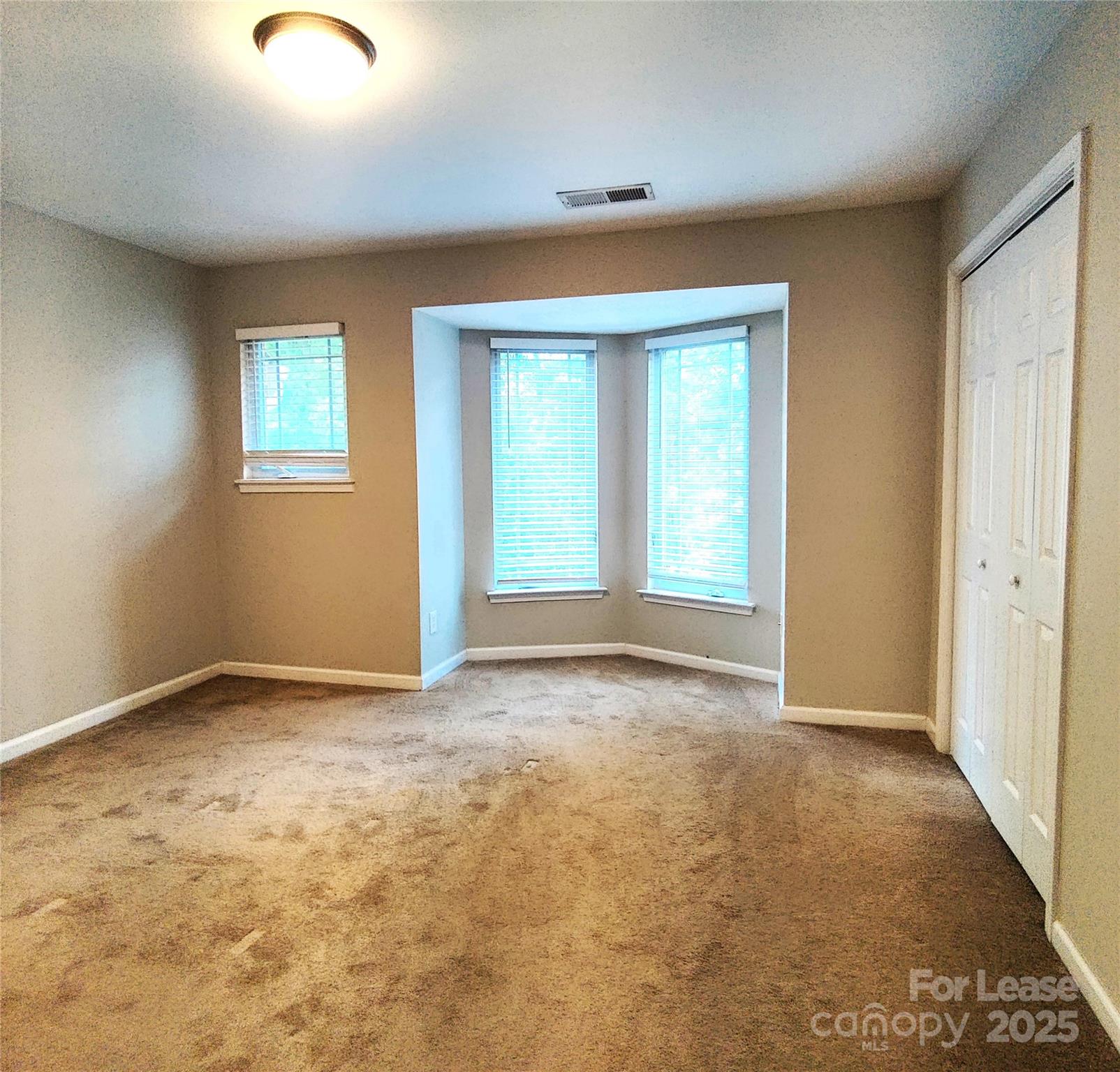 1132 Kurt Court Charlotte, NC 28209 - Photo 12 of 24 an empty room with windows