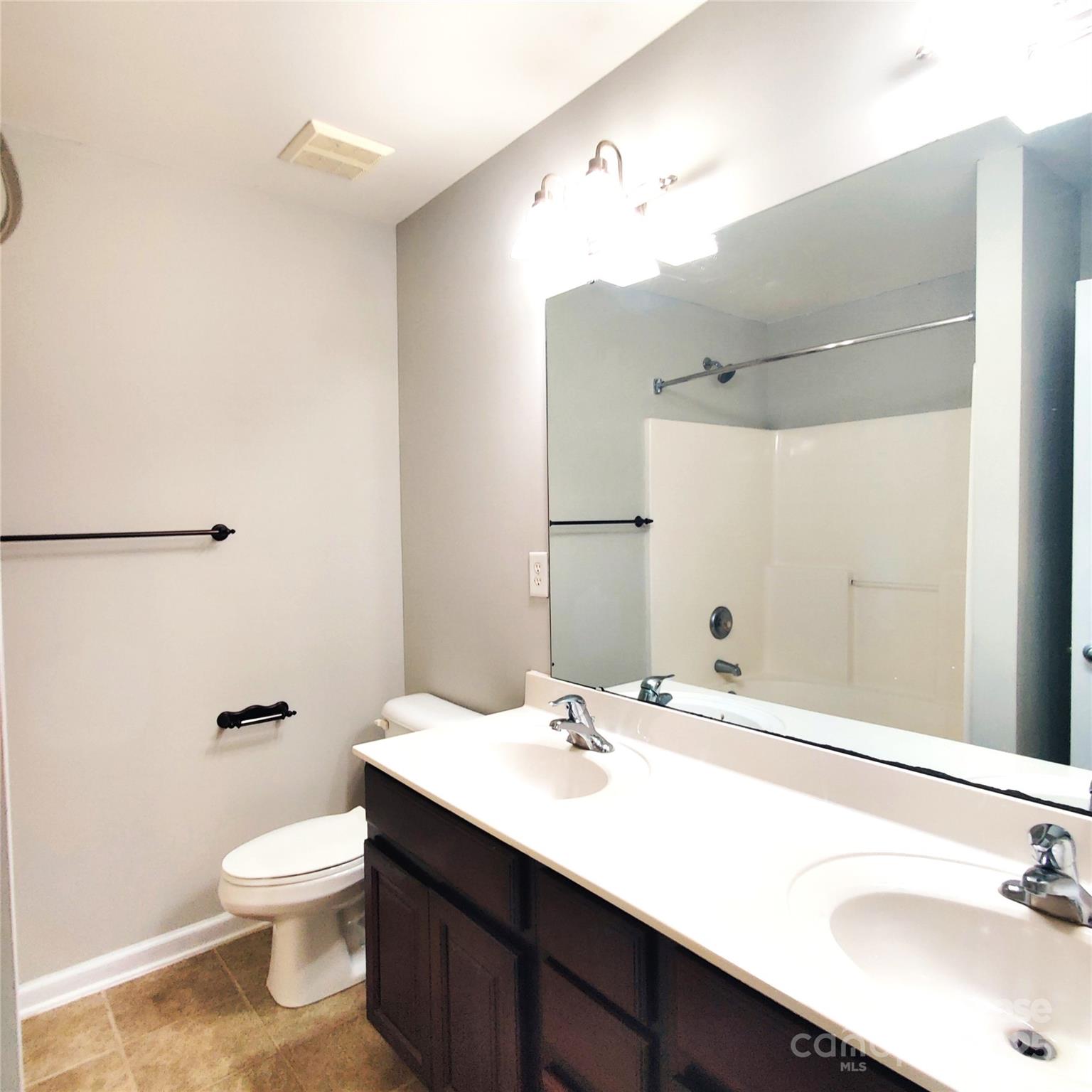 1132 Kurt Court Charlotte, NC 28209 - Photo 14 of 24 a bathroom with a sink a toilet and shower