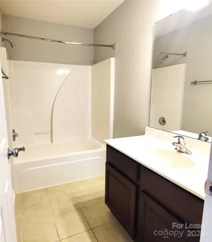 a bathroom with a bathtub and a sink
