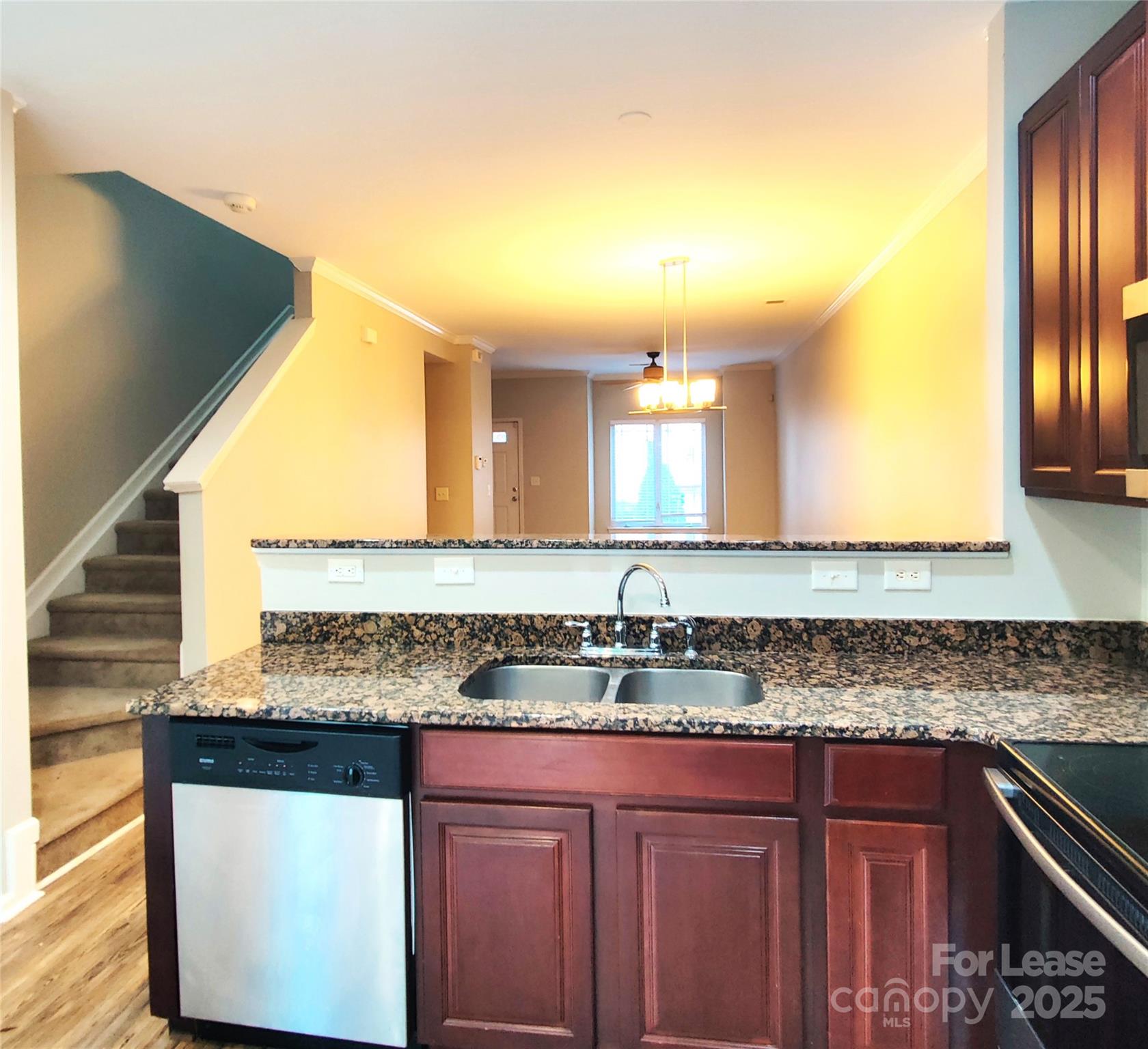 1132 Kurt Court Charlotte, NC 28209 - Photo 8 of 24 a kitchen with granite countertop a sink and cabinets
