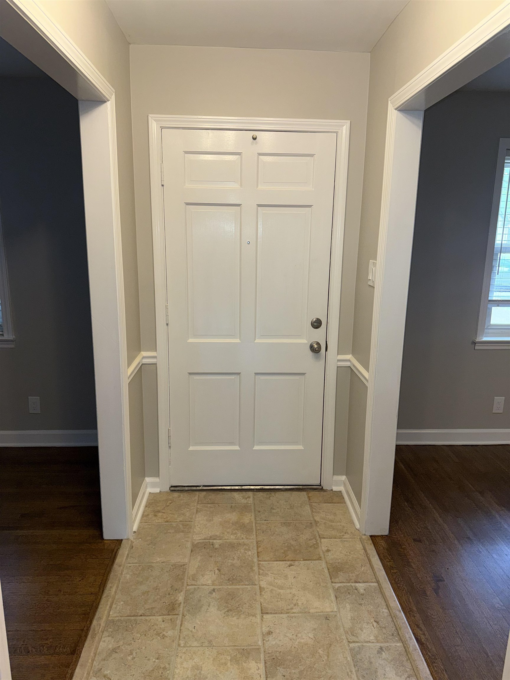 1918 Cherry Road Memphis, TN 38117 - Photo 12 of 26 Entryway featuring a paneled door, neutral wall color, and wainscoting details
