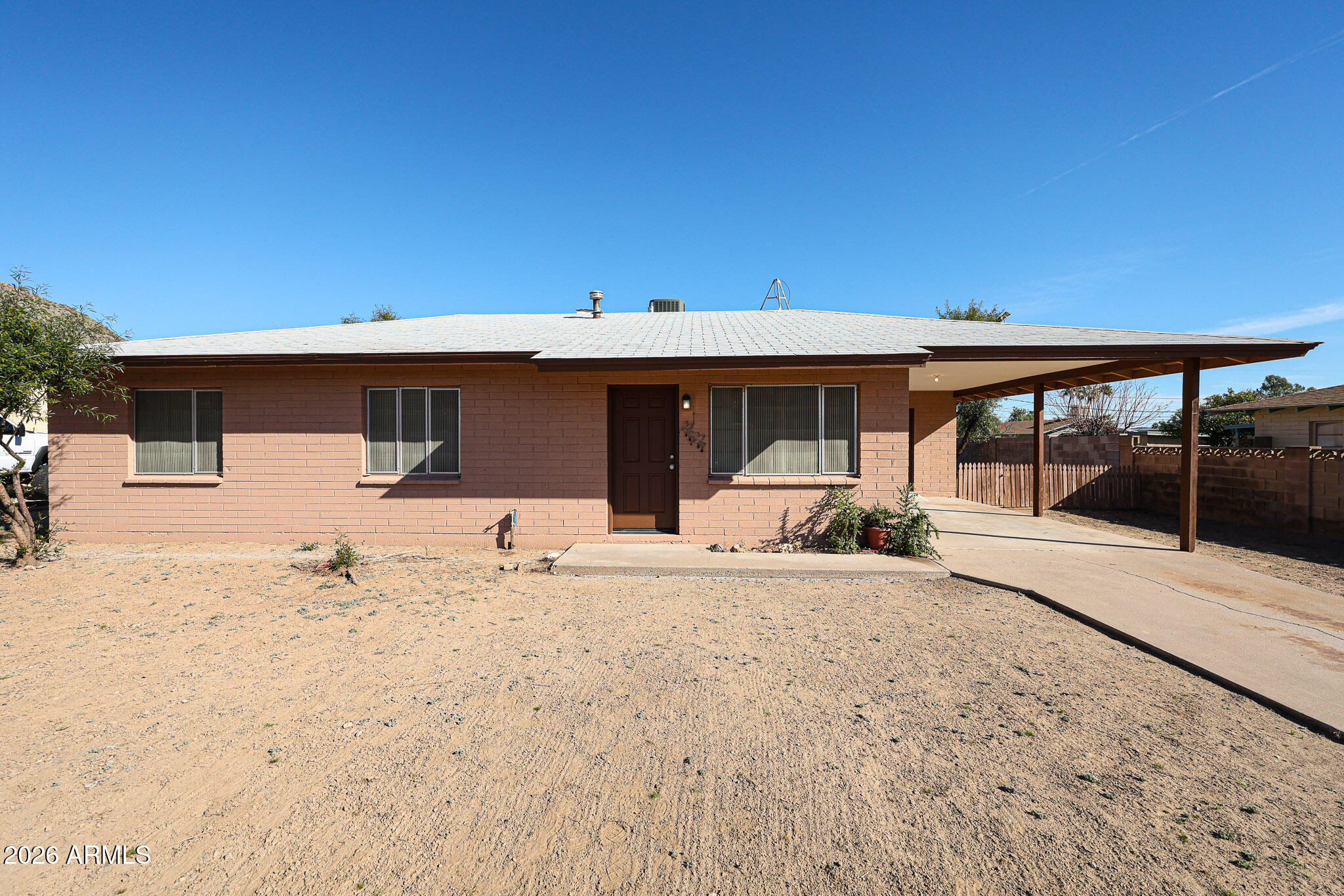 a front view of a house with a patio