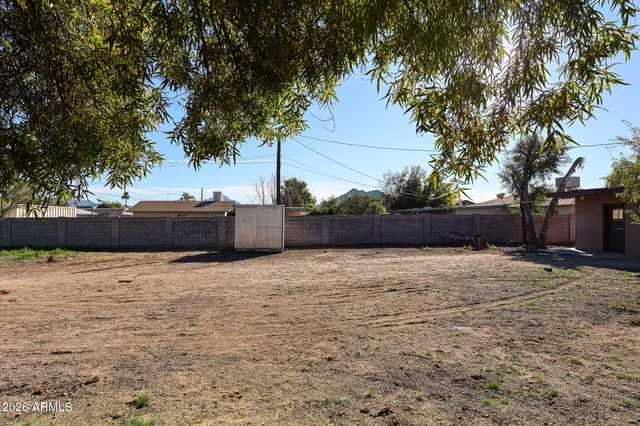 a backyard of a house with lots of green space