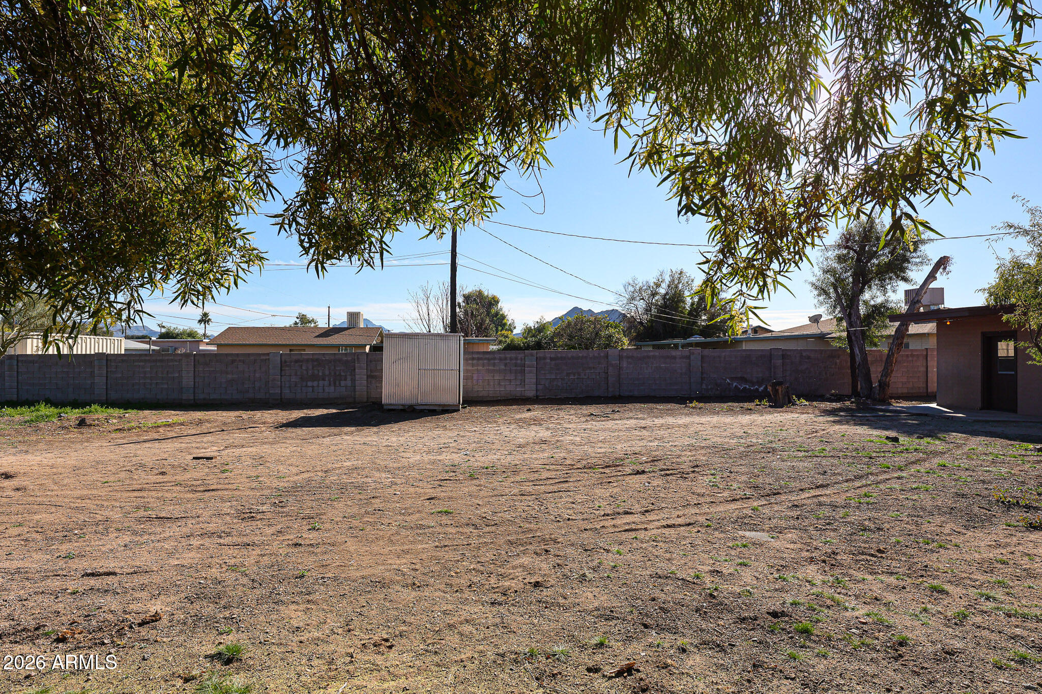 12819 North 22nd Place Phoenix, AZ 85022 - Photo 11 of 28 a backyard of a house with lots of green space