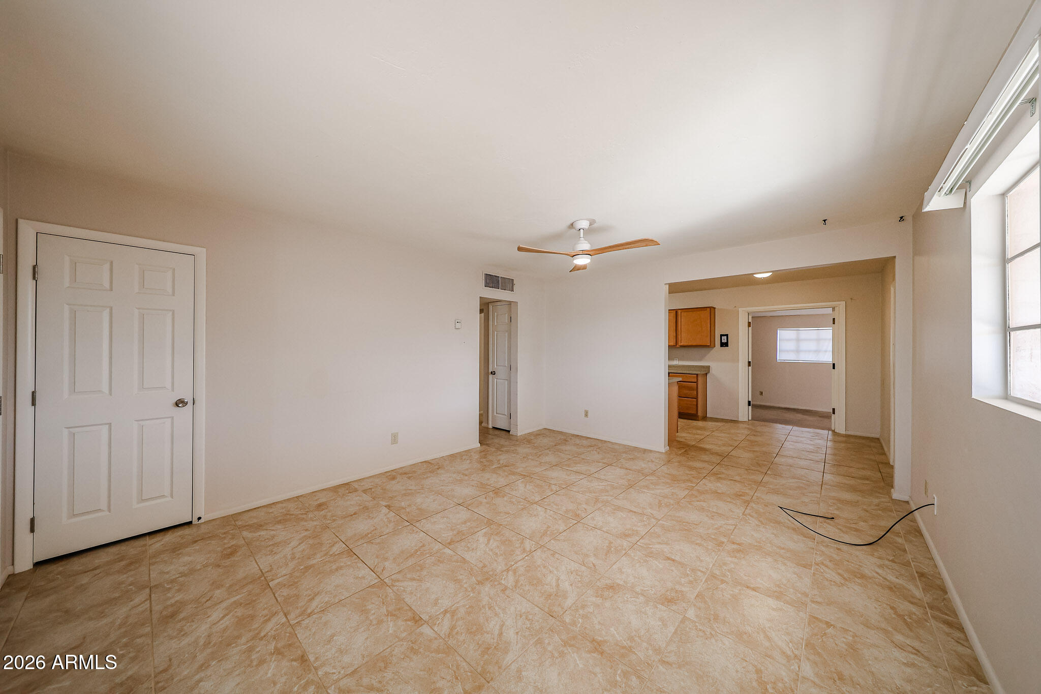 12819 North 22nd Place Phoenix, AZ 85022 - Photo 19 of 28 a view of an empty room with window and wooden floor