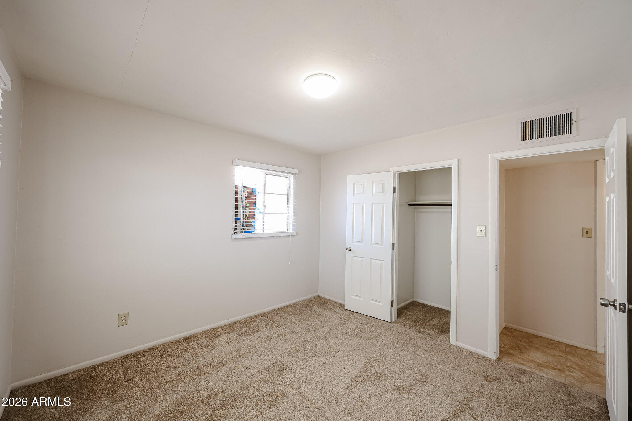 12819 North 22nd Place Phoenix, AZ 85022 - Photo 20 of 28 a view of an empty room with a window