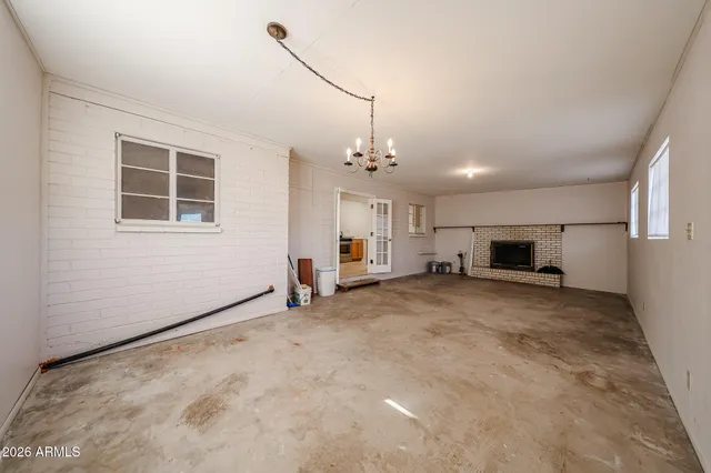 a view of a livingroom with furniture and a window