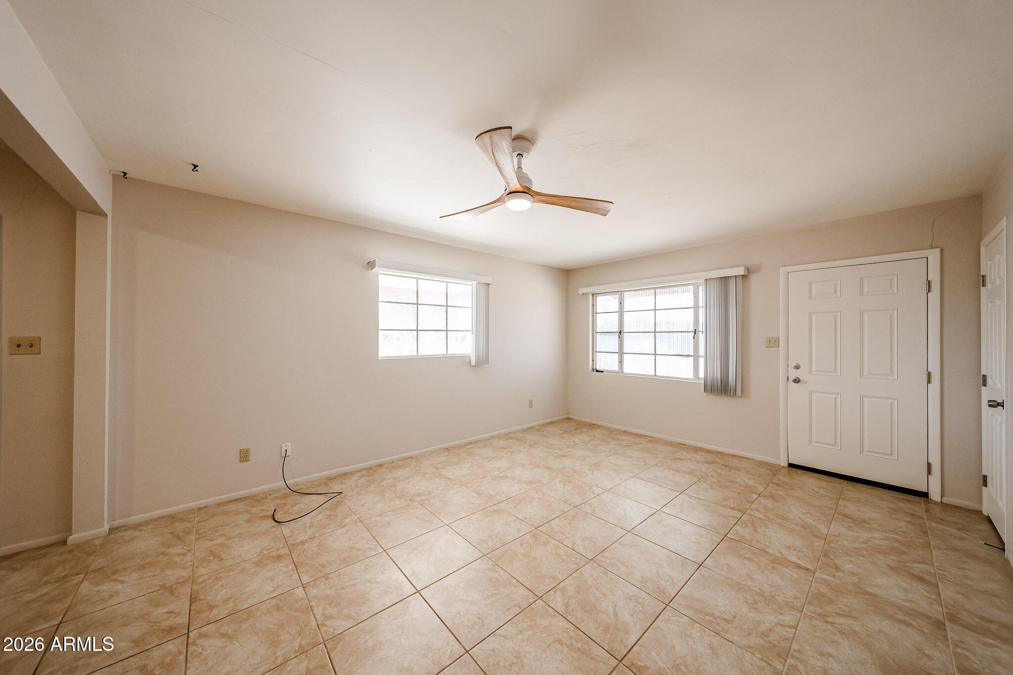 12819 North 22nd Place Phoenix, AZ 85022 - Photo 3 of 28 a view of an empty room with a window