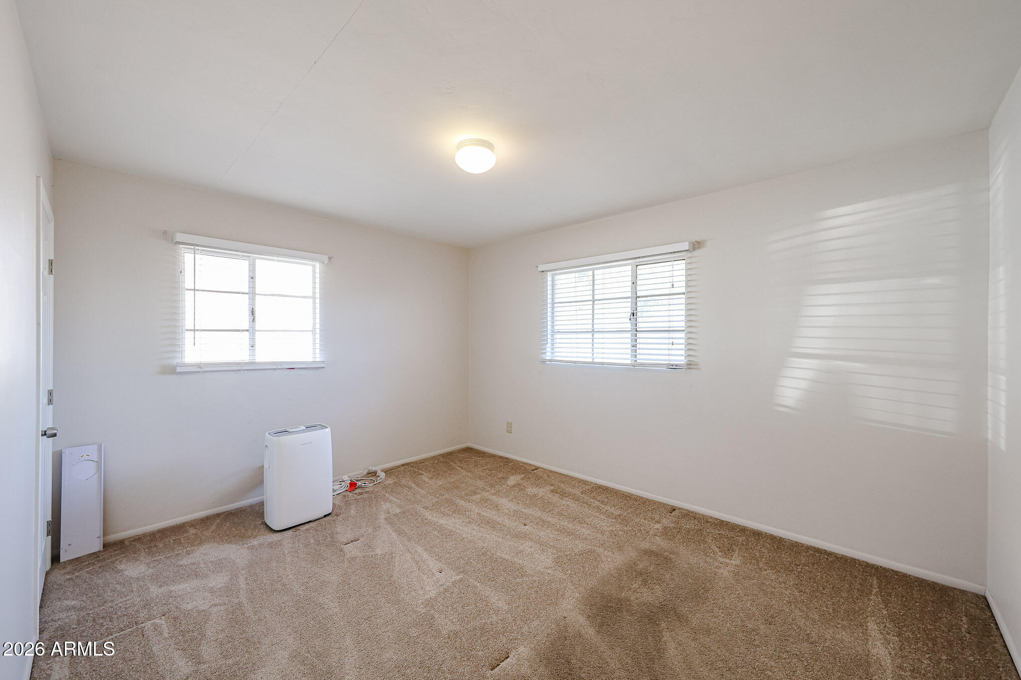 12819 North 22nd Place Phoenix, AZ 85022 - Photo 6 of 28 a view of a room that has a window