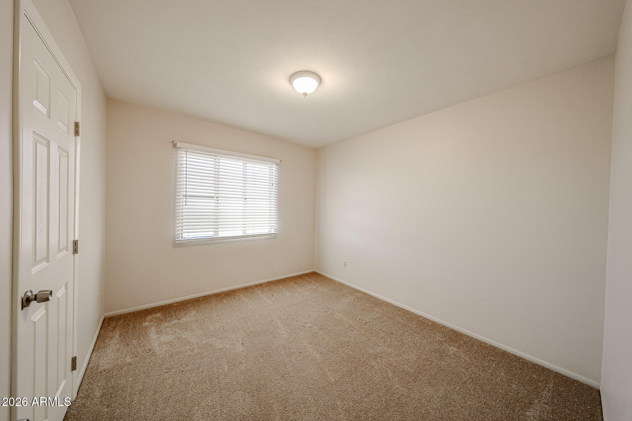 12819 North 22nd Place Phoenix, AZ 85022 - Photo 7 of 28 an empty room with a window