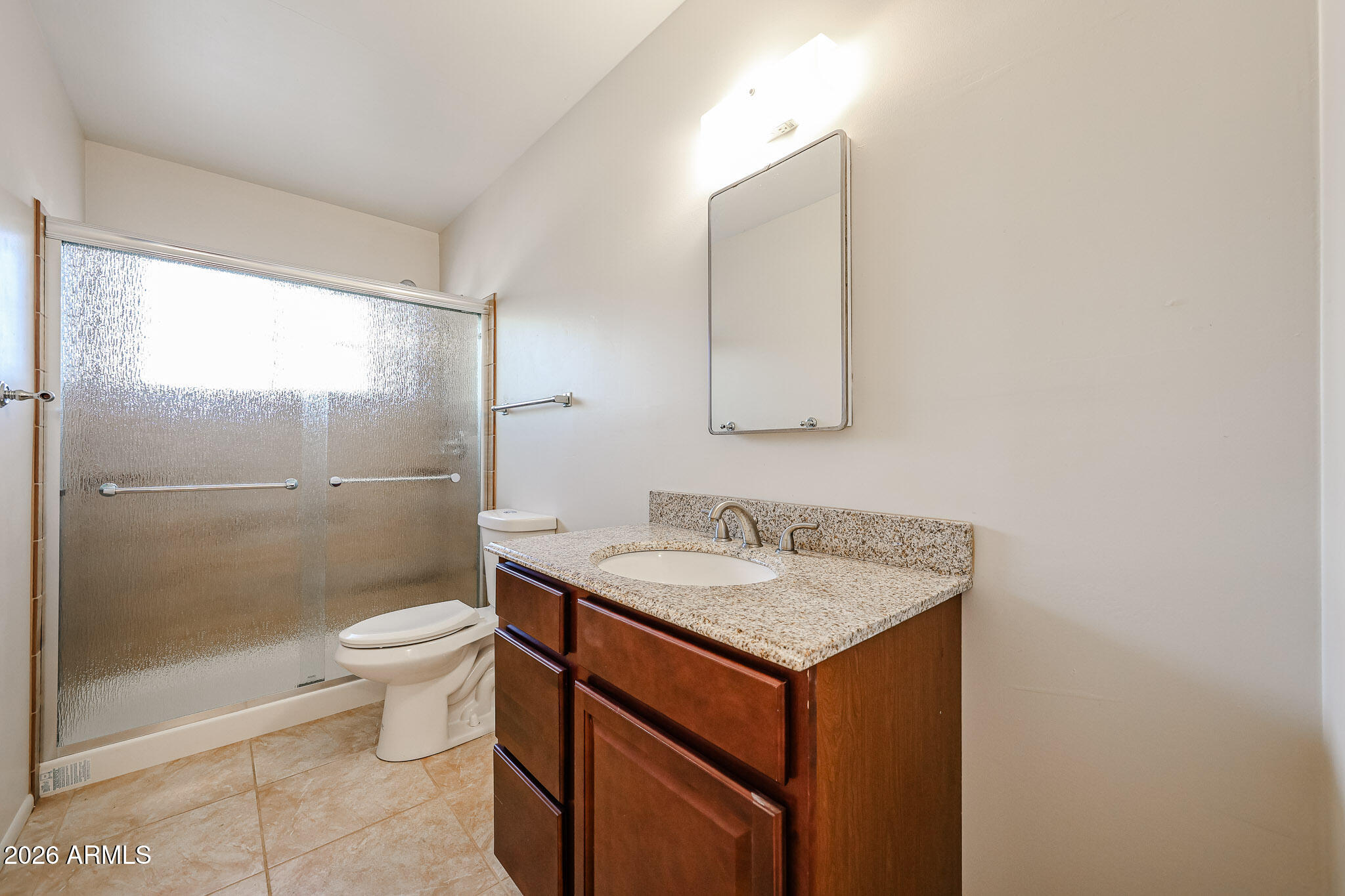 12819 North 22nd Place Phoenix, AZ 85022 - Photo 8 of 28 a bathroom with a sink toilet and shower