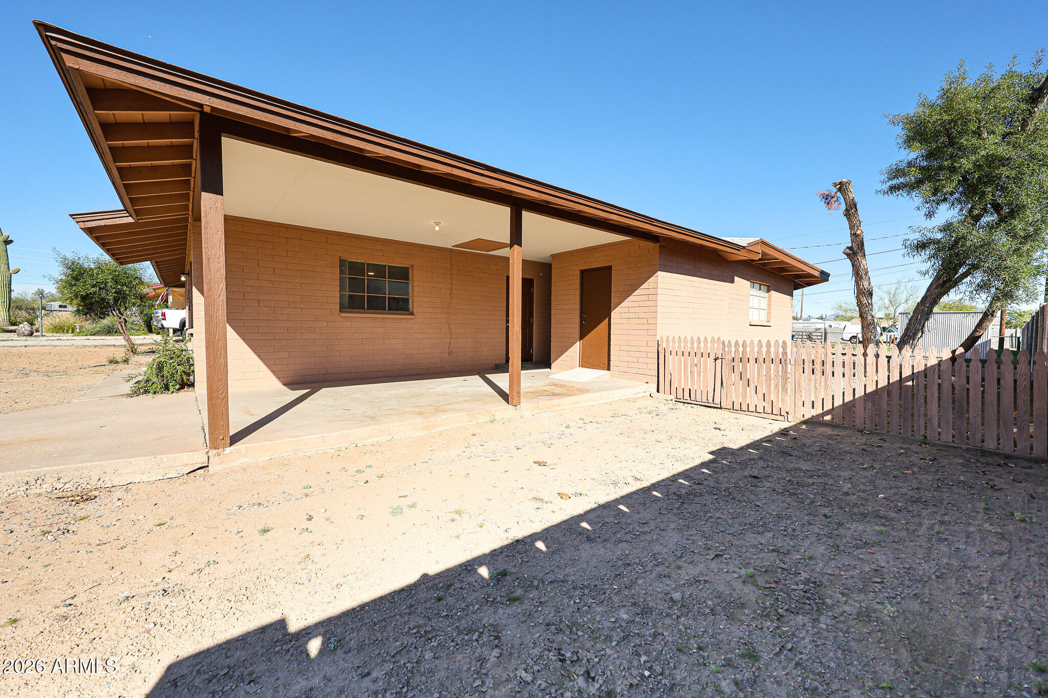 12819 North 22nd Place Phoenix, AZ 85022 - Photo 10 of 28 a backyard of a house with wooden fence