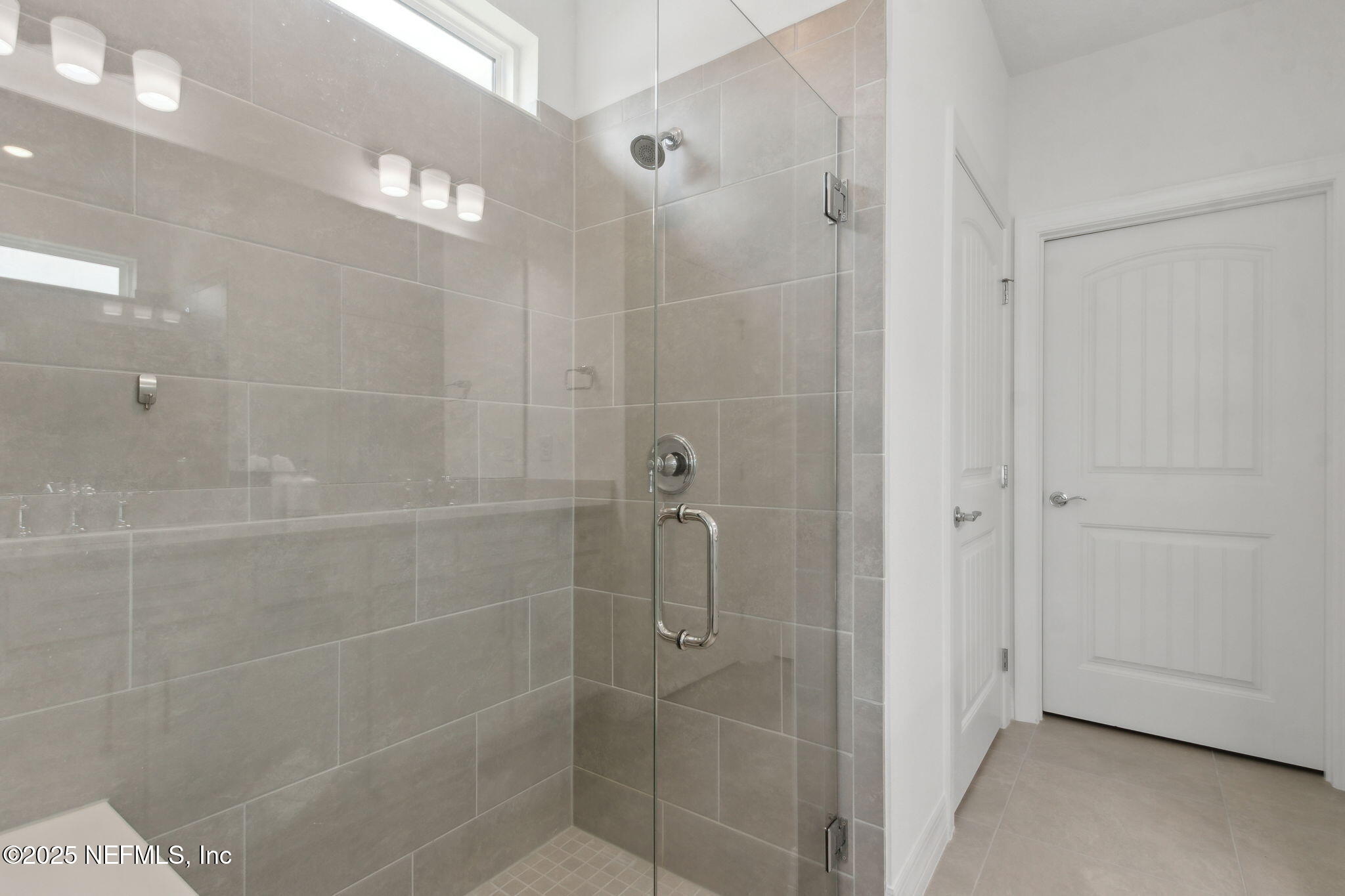 350 Tranquil Trl Circle Yulee, FL 32097 - Photo 20 of 33 a bathroom with a shower