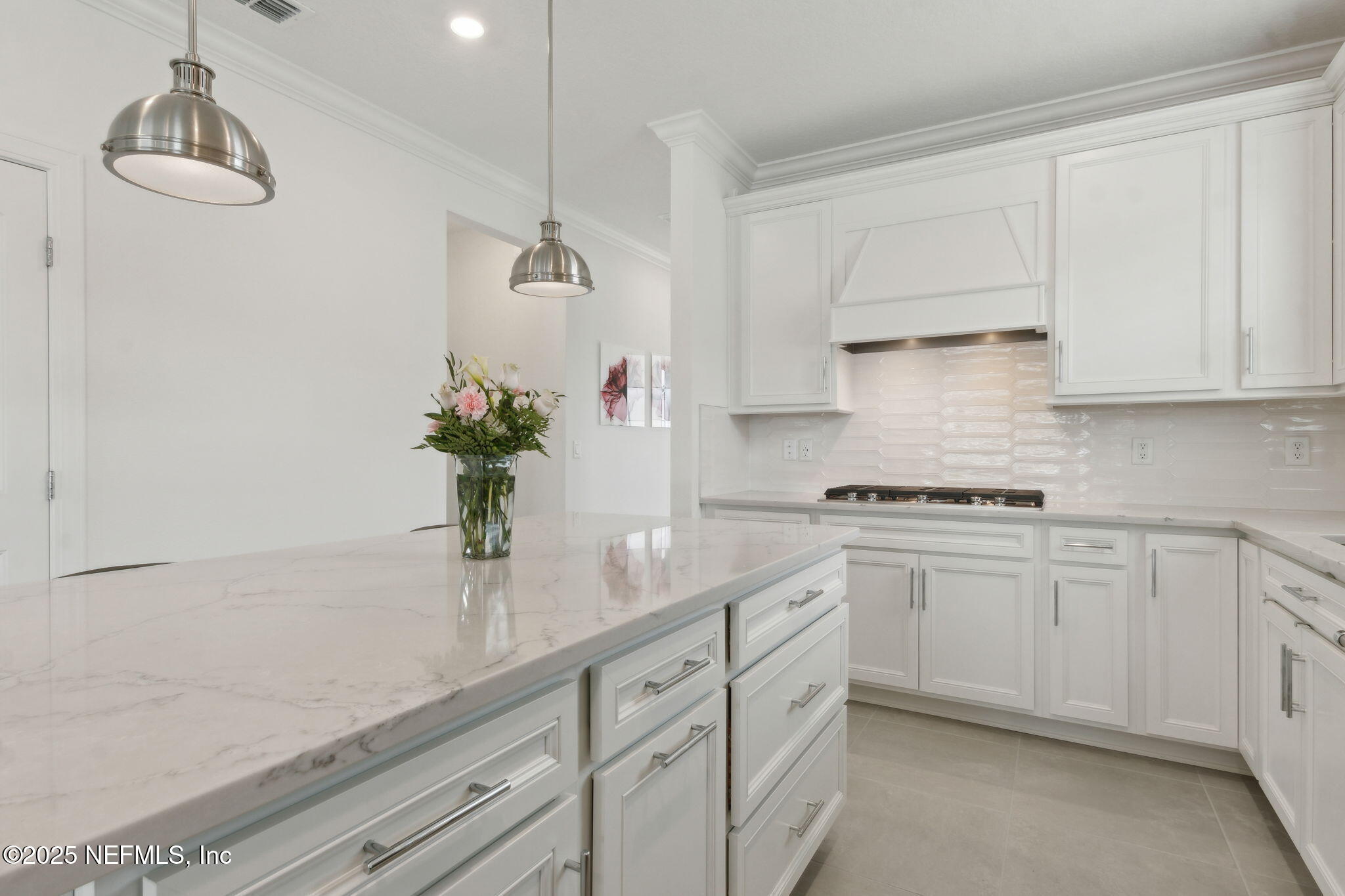 350 Tranquil Trl Circle Yulee, FL 32097 - Photo 10 of 33 a kitchen with a white cabinets and white appliances
