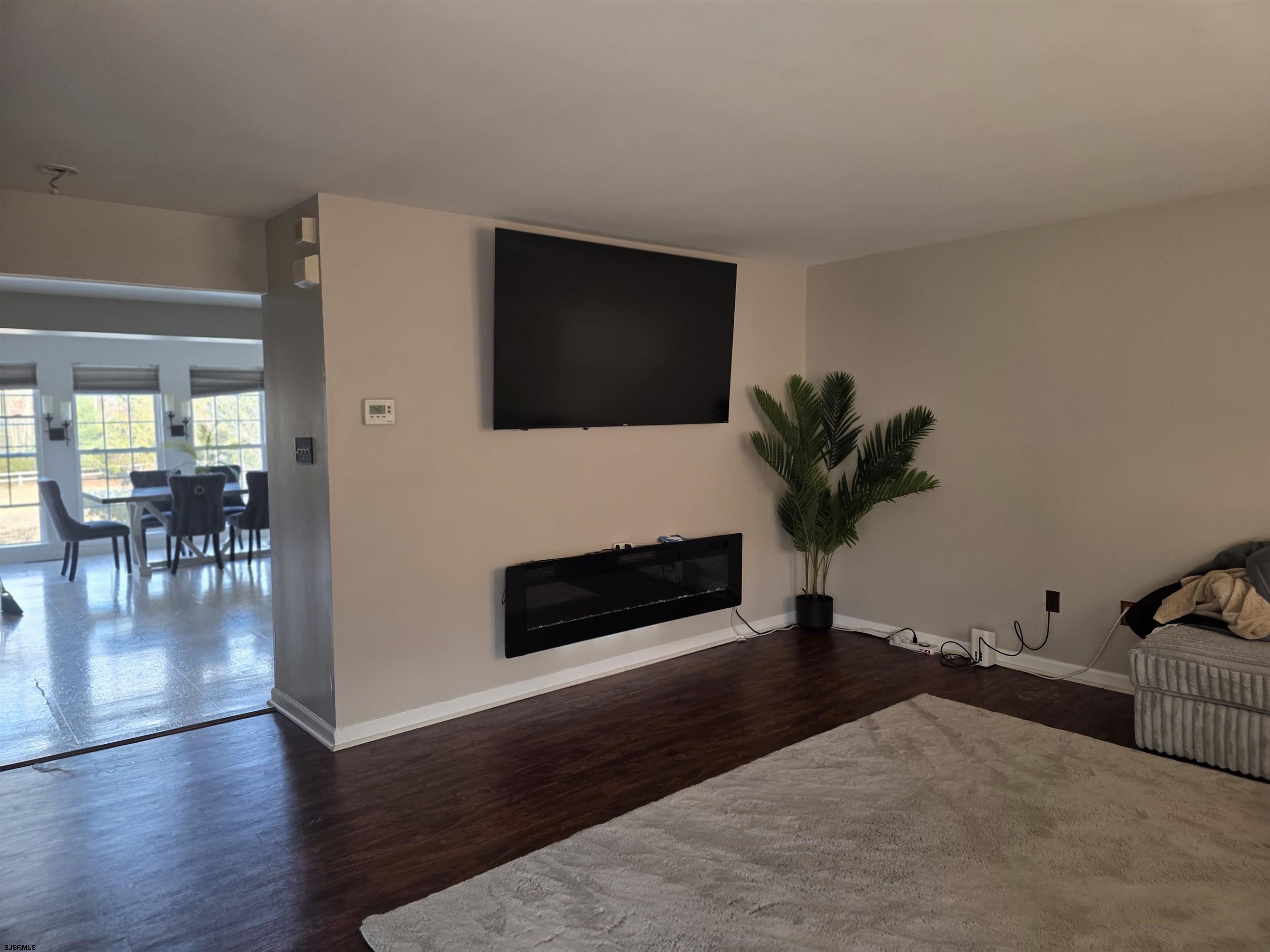1002 Carlisle Road Egg Harbor Township, NJ 08234 - Photo 14 of 18 a living room with furniture wooden floor and flat screen tv