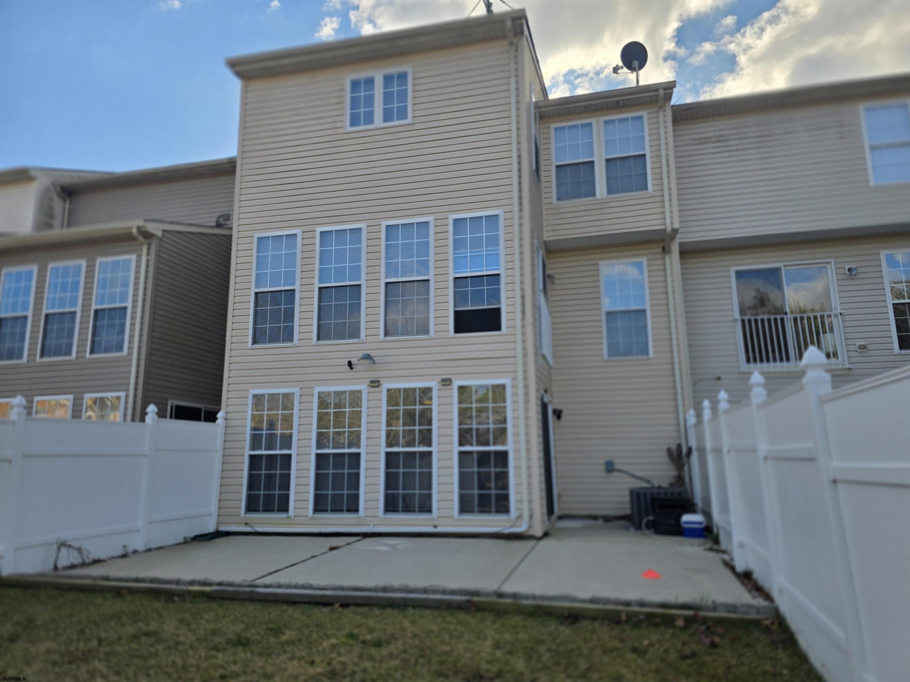 1002 Carlisle Road Egg Harbor Township, NJ 08234 - Photo 9 of 18 a view of a house with backyard porch and outdoor seating