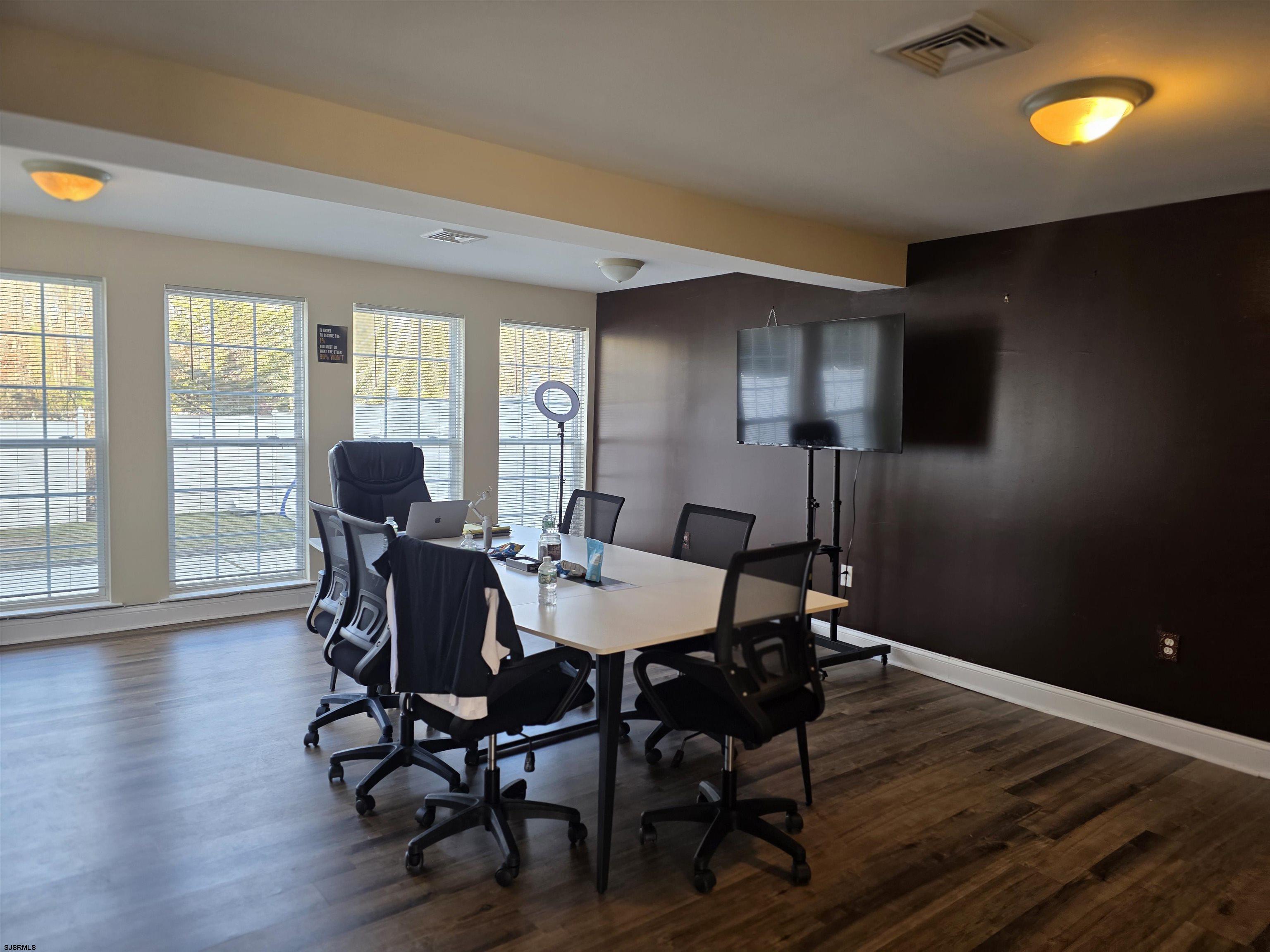 1002 Carlisle Road Egg Harbor Township, NJ 08234 - Photo 10 of 18 a view of a dining room with furniture and wooden floor