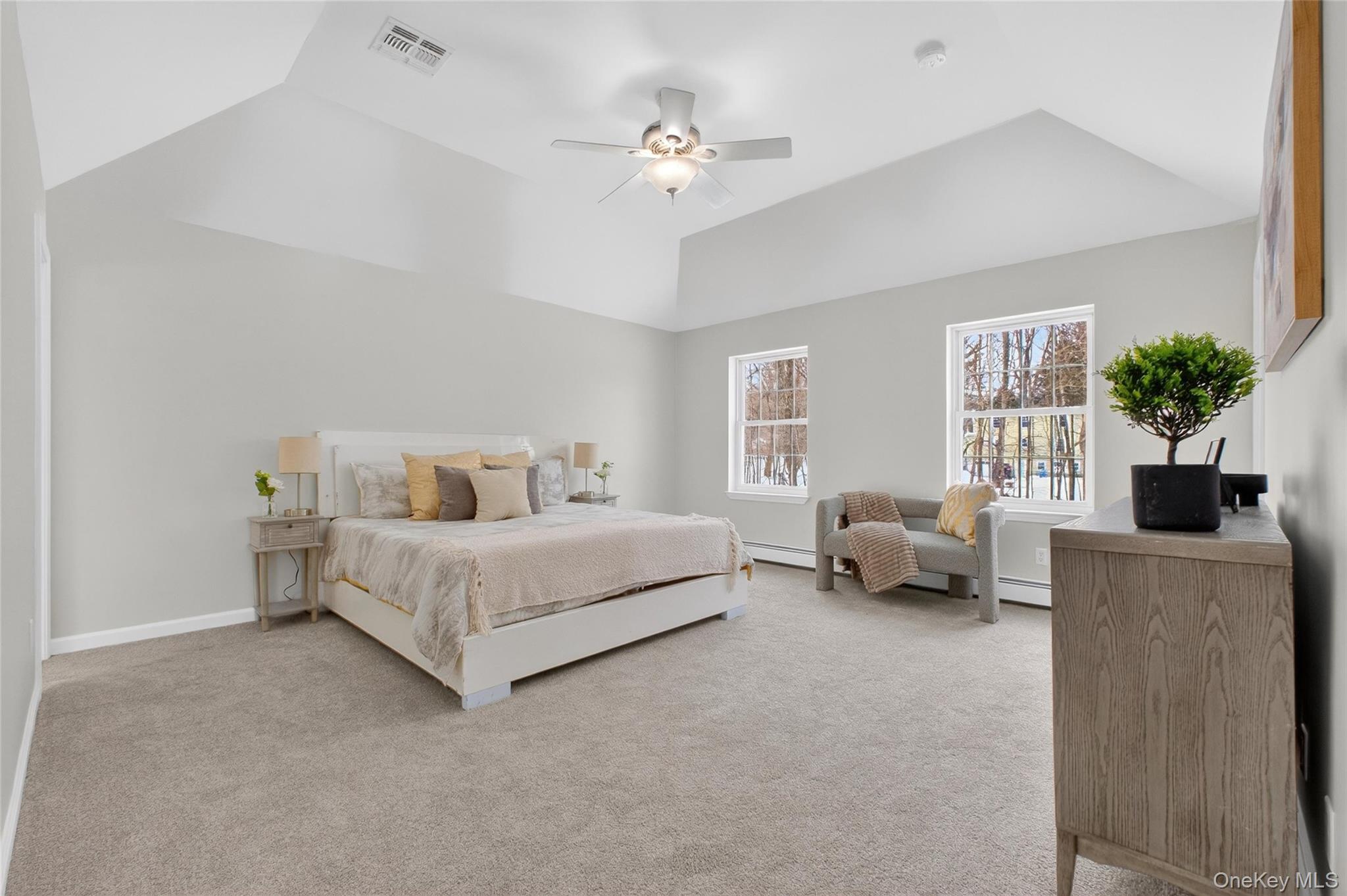 33 Berea Road Walden, NY 12586 - Photo 23 of 44 Bedroom with light colored carpet, a ceiling fan, vaulted ceiling, and a baseboard heating unit