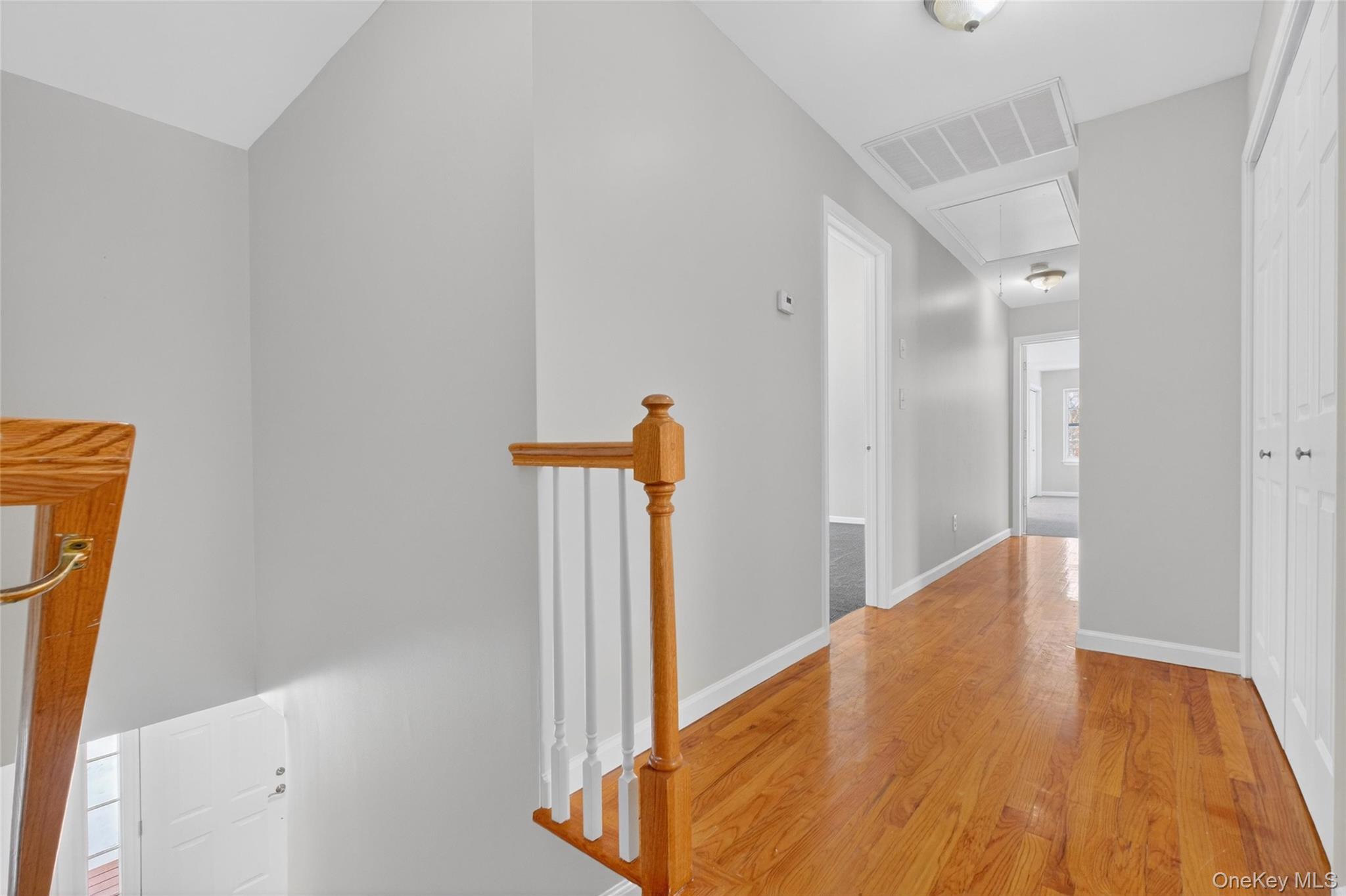 33 Berea Road Walden, NY 12586 - Photo 29 of 44 Corridor featuring attic access, wood finished floors, and an upstairs landing