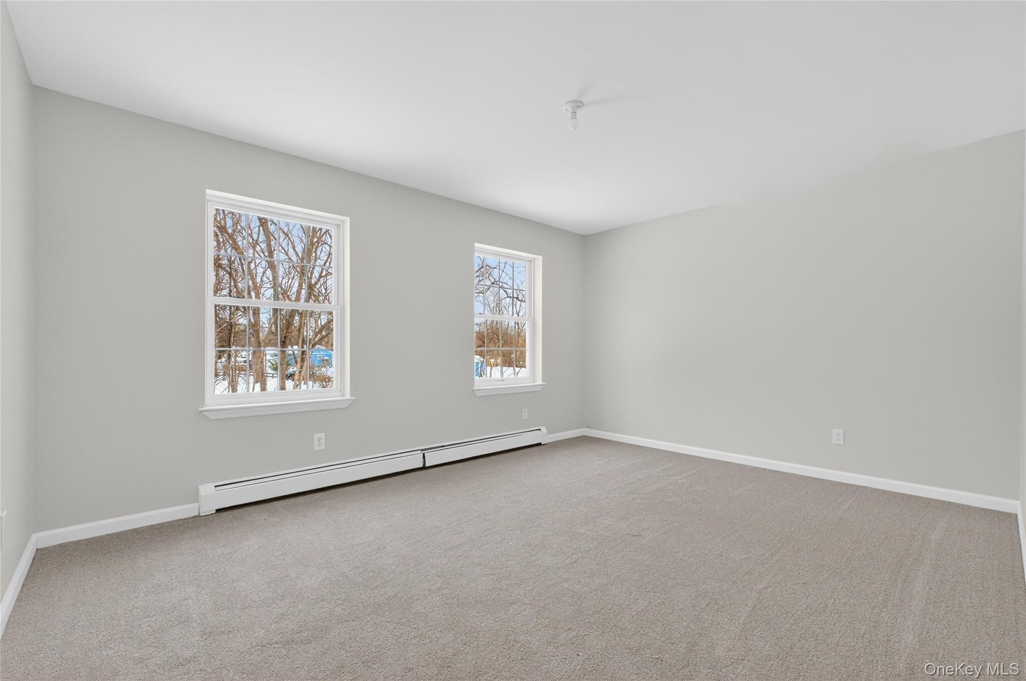 33 Berea Road Walden, NY 12586 - Photo 30 of 44 Spare room featuring baseboard heating and light carpet
