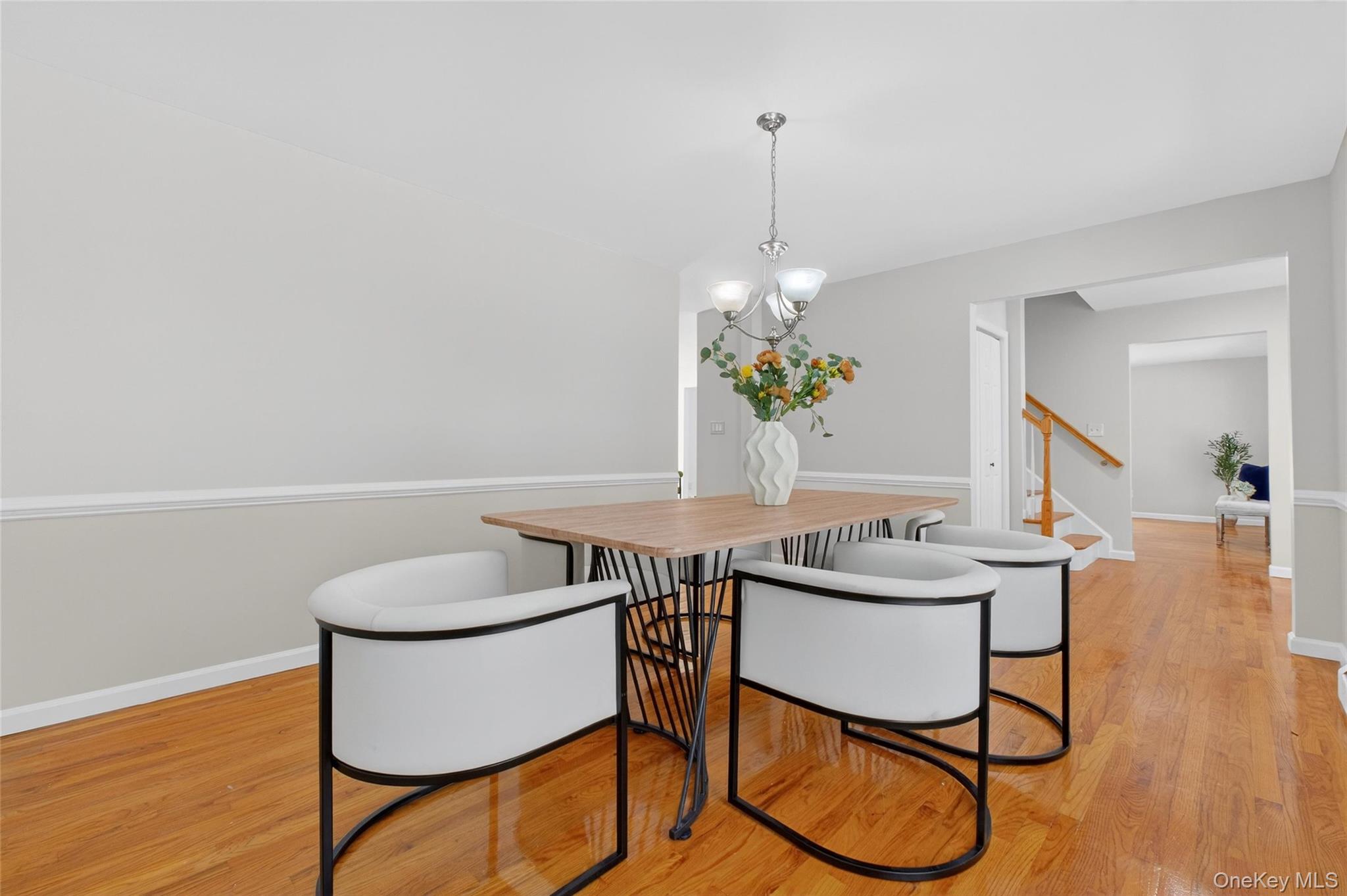 33 Berea Road Walden, NY 12586 - Photo 8 of 44 Dining room with light wood finished floors, a chandelier, and stairway