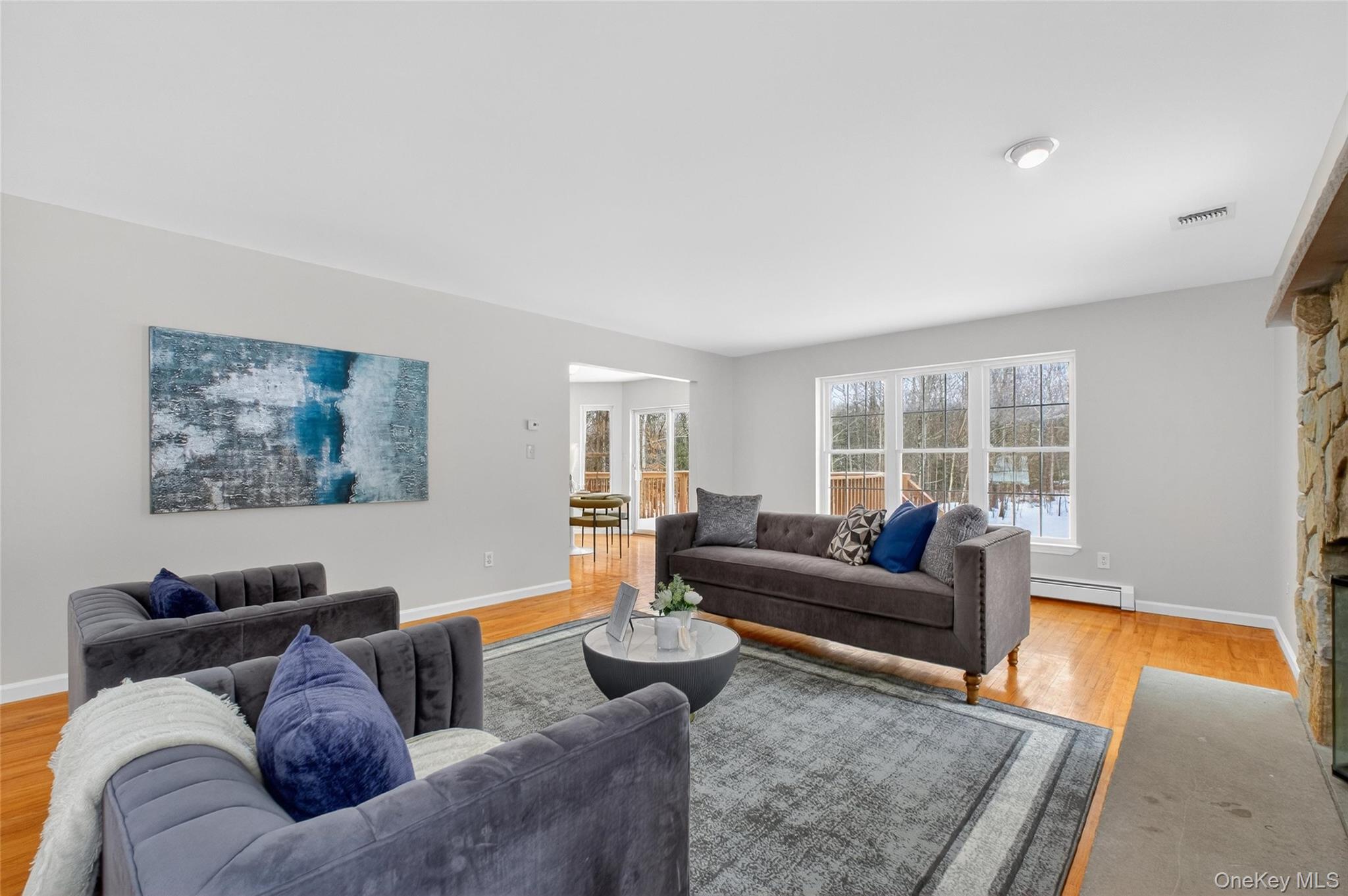 33 Berea Road Walden, NY 12586 - Photo 9 of 44 Living area with baseboard heating and light wood finished floors