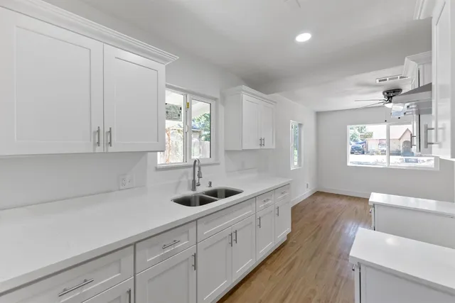 an empty room with a door and wooden floor