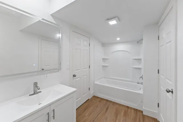 a bathroom with a sink and a mirror