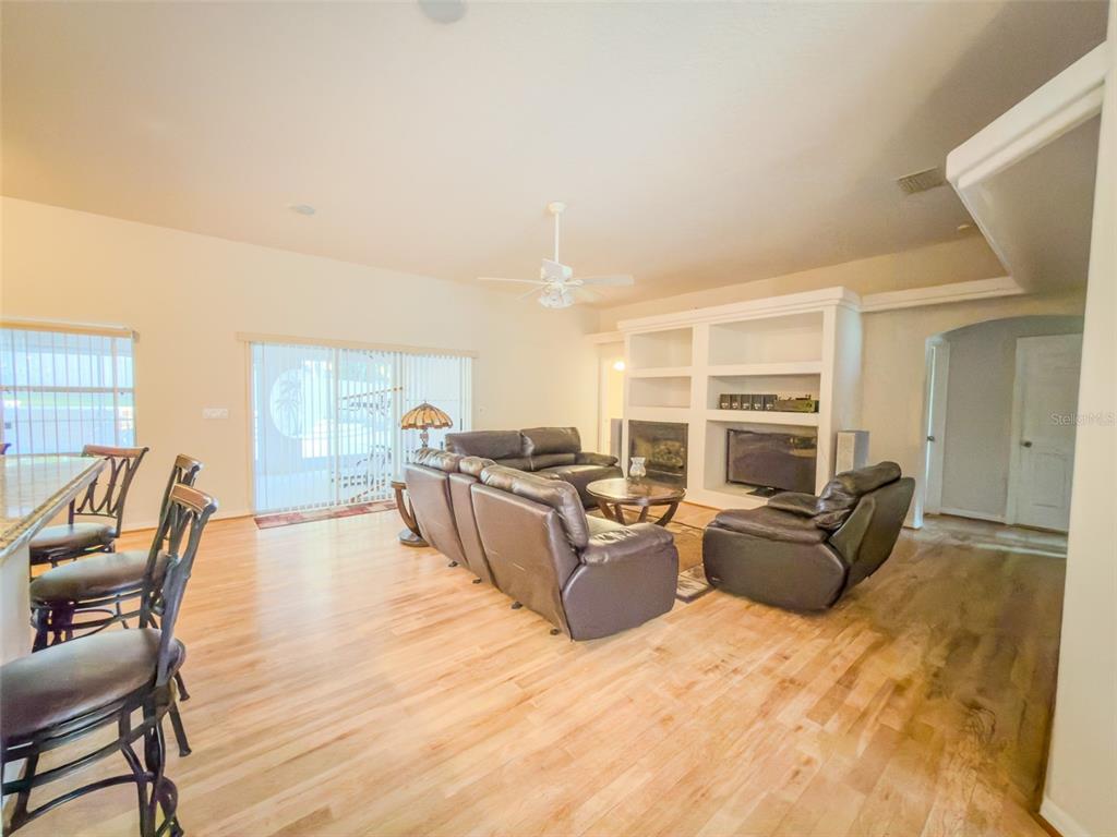 4 Weston Road Leesburg, FL 34748 - Photo 33 of 55 a living room with furniture and a large window