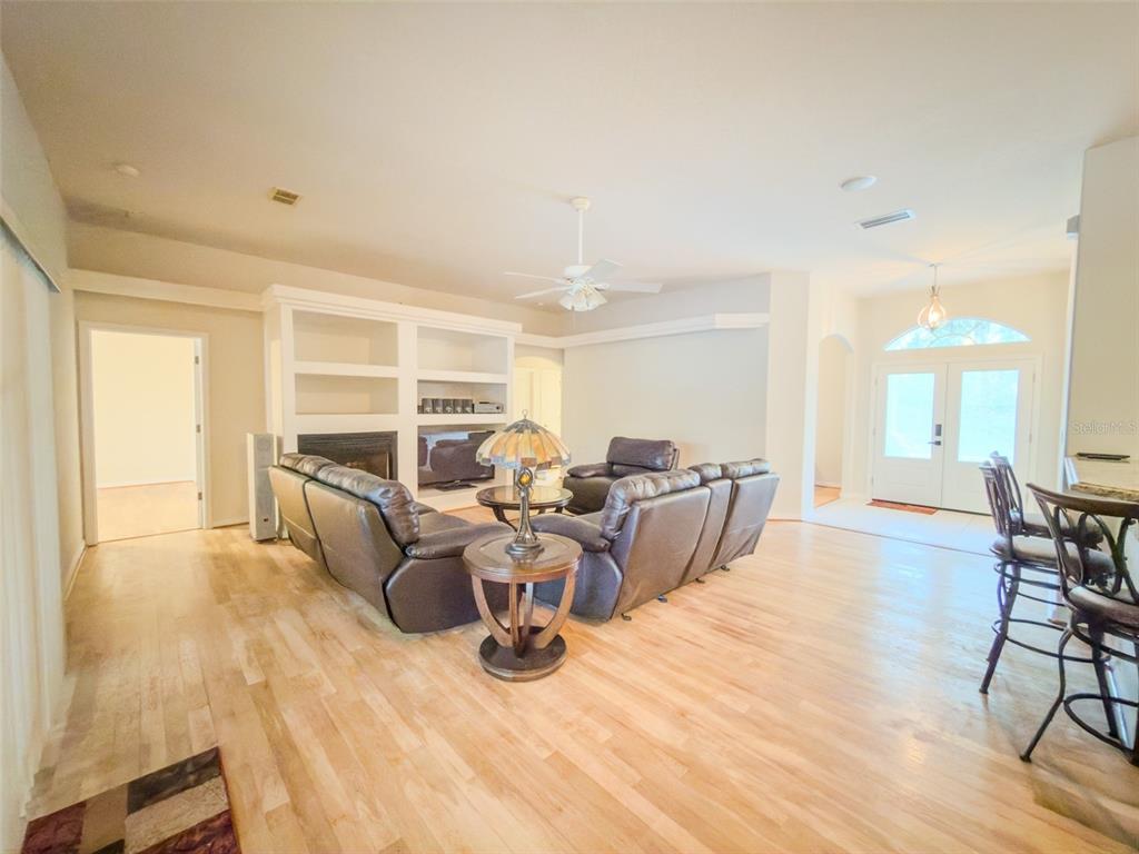 4 Weston Road Leesburg, FL 34748 - Photo 34 of 55 a living room with furniture large window and wooden floor