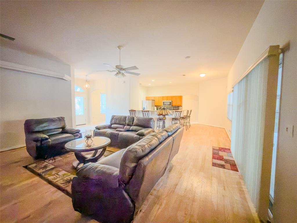 4 Weston Road Leesburg, FL 34748 - Photo 35 of 55 a living room with furniture and a wooden floor