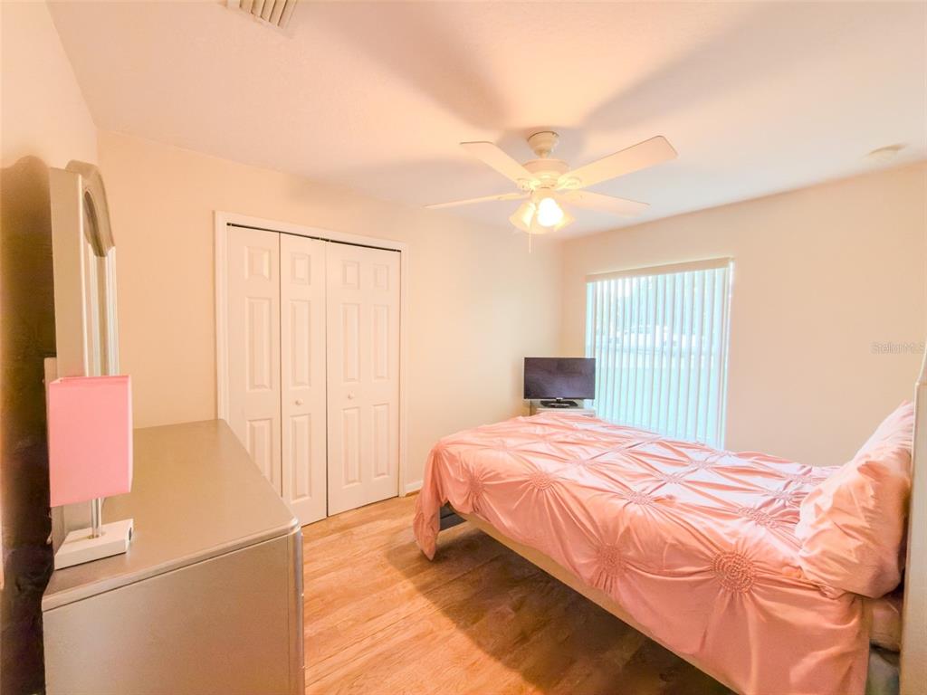 4 Weston Road Leesburg, FL 34748 - Photo 41 of 55 a bedroom with a bed and a window