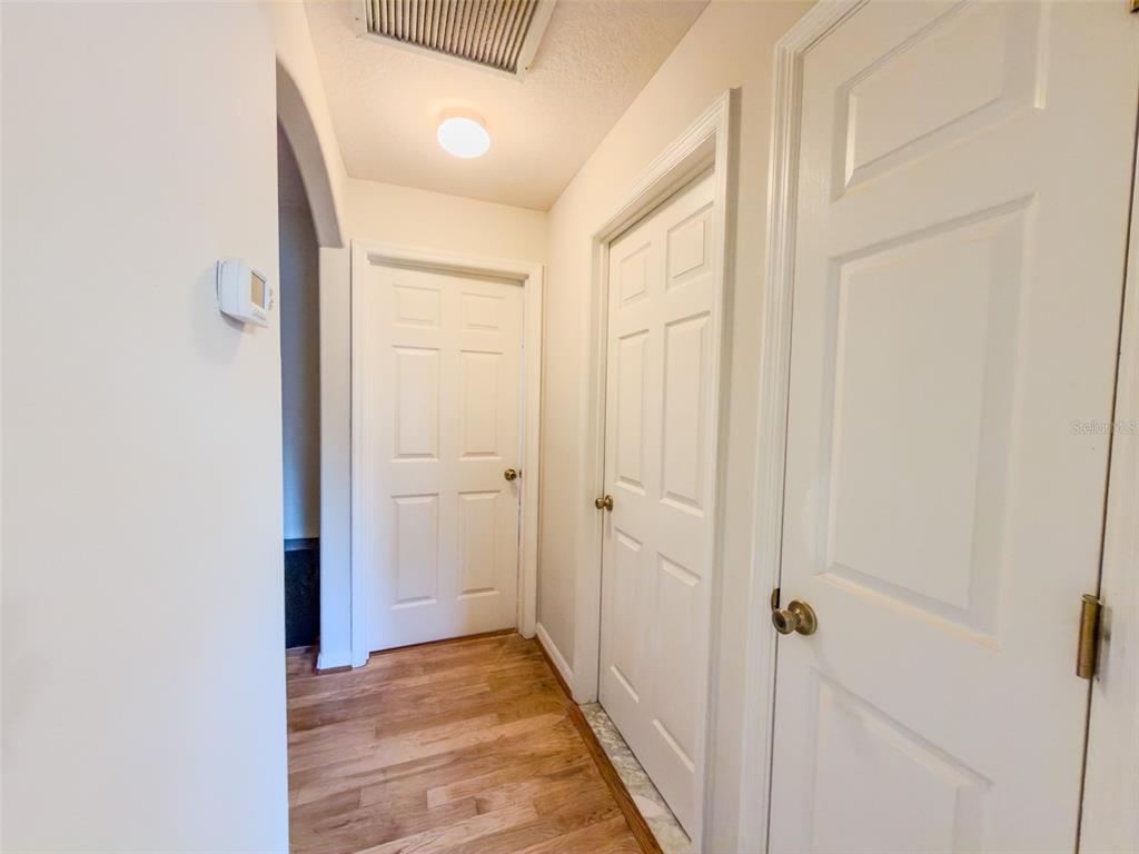 4 Weston Road Leesburg, FL 34748 - Photo 48 of 55 a view of a hallway with wooden floor and entryway