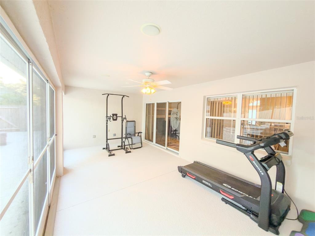 4 Weston Road Leesburg, FL 34748 - Photo 51 of 55 a view of a room with gym equipment